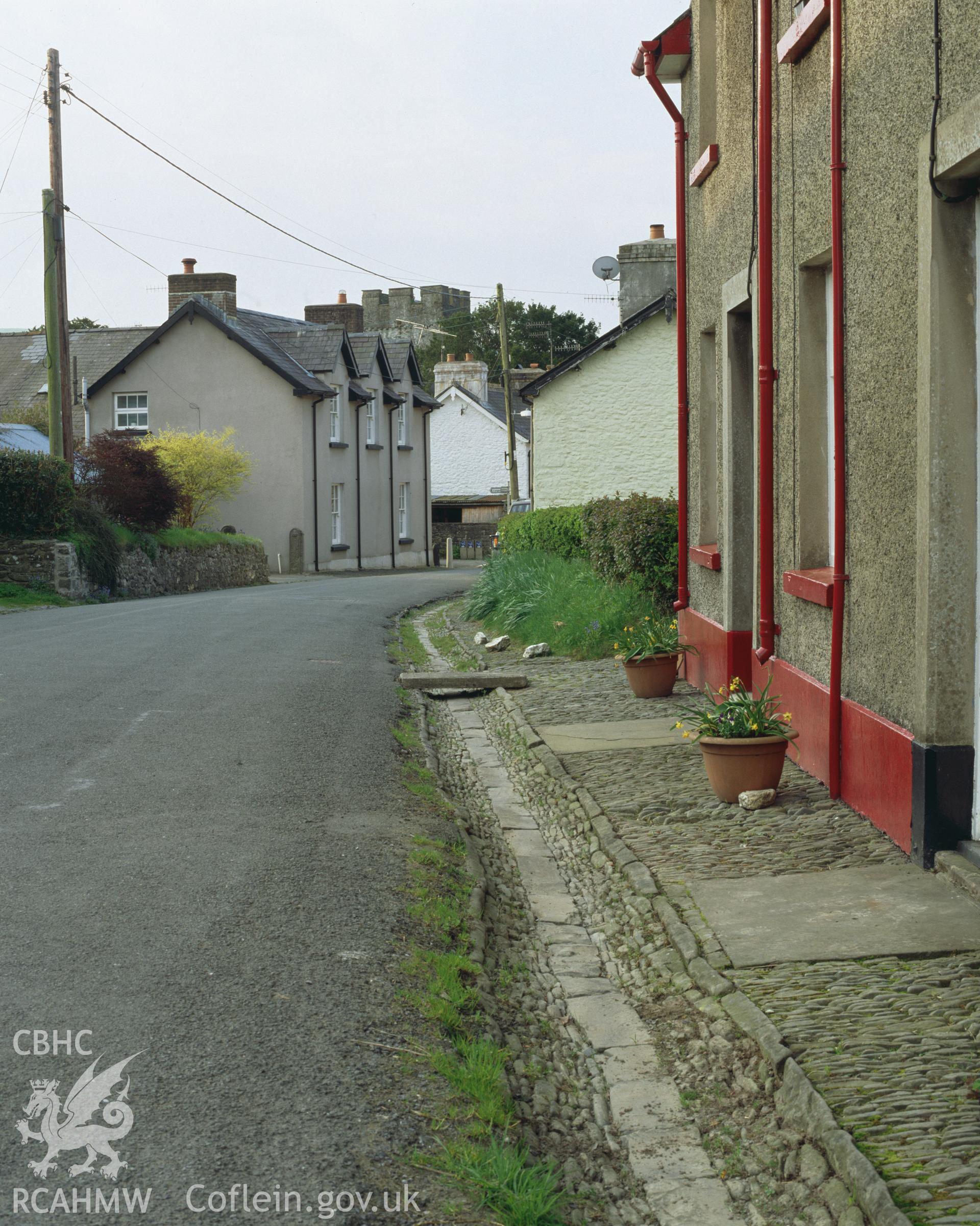 Colour transparency showing view of a street in Cilycwm, produced by Iain Wright, June 2004.