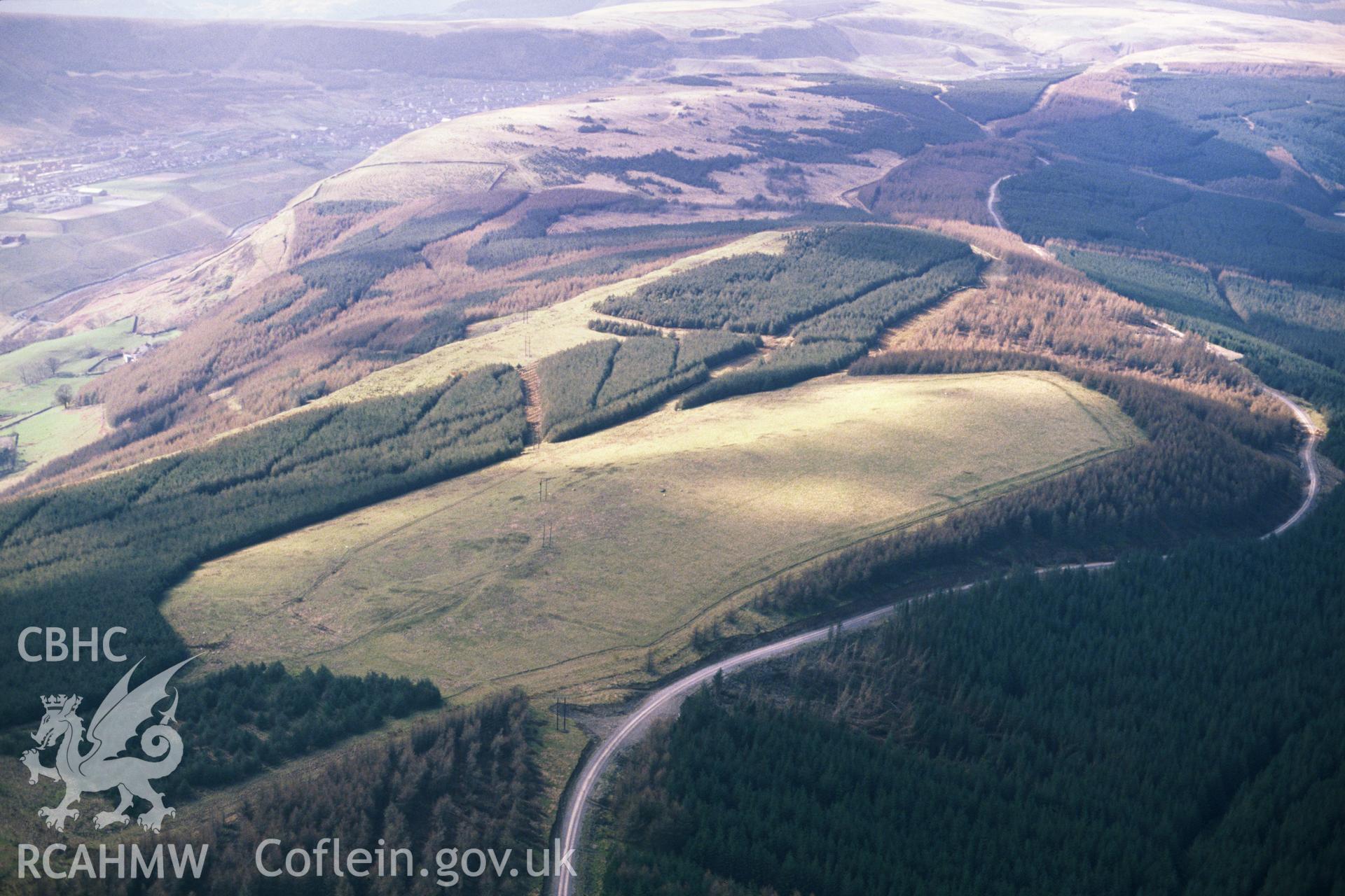 Slide of RCAHMW colour oblique aerial photograph of Twyn Y Bridallt Roman Camp, taken by C.R. Musson, 26/3/1990.