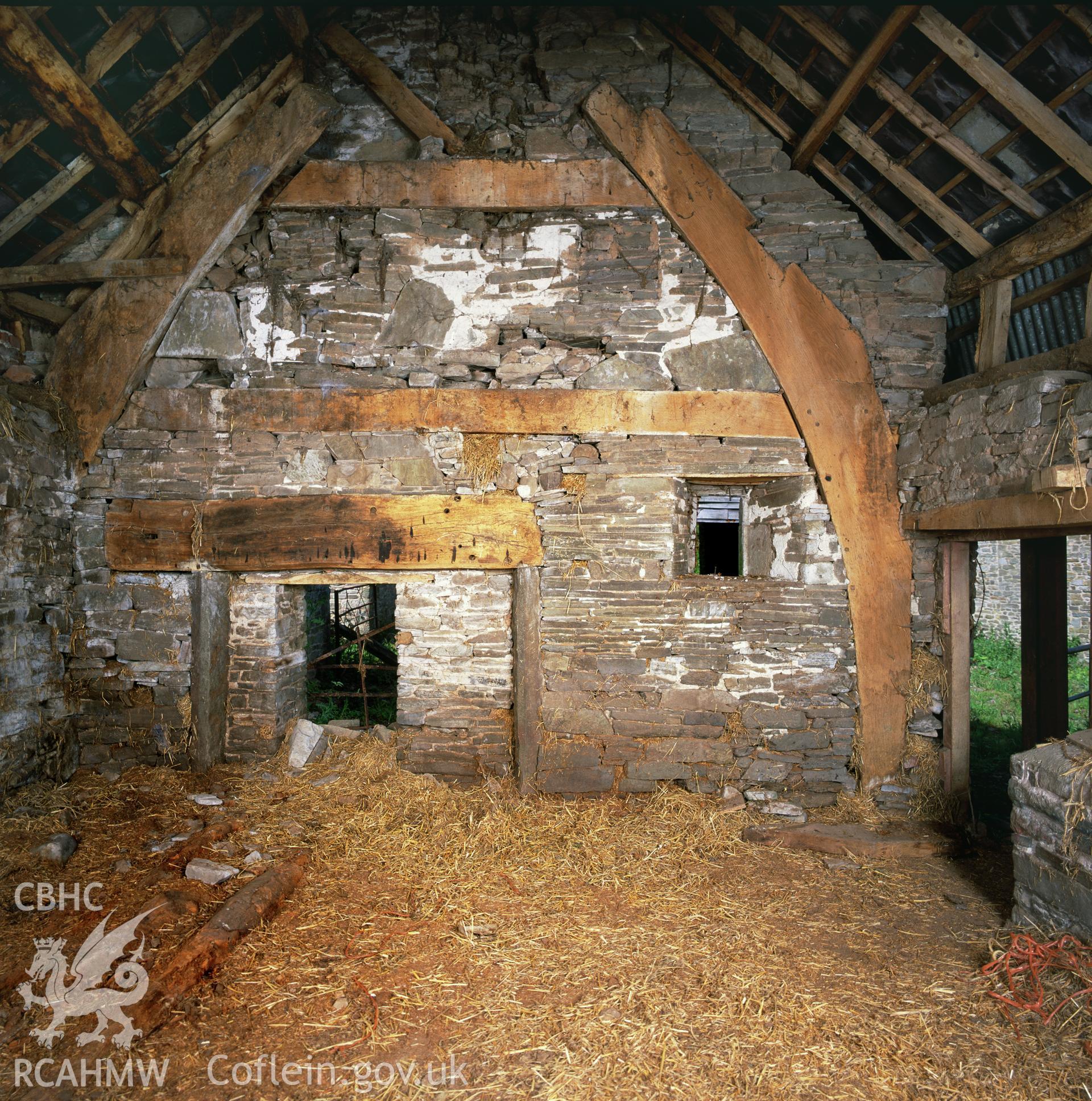 RCAHMW colour transparency showing  the cruck frame of the cowhouse at Clyro Court Farm, taken by Fleur James, August 2003