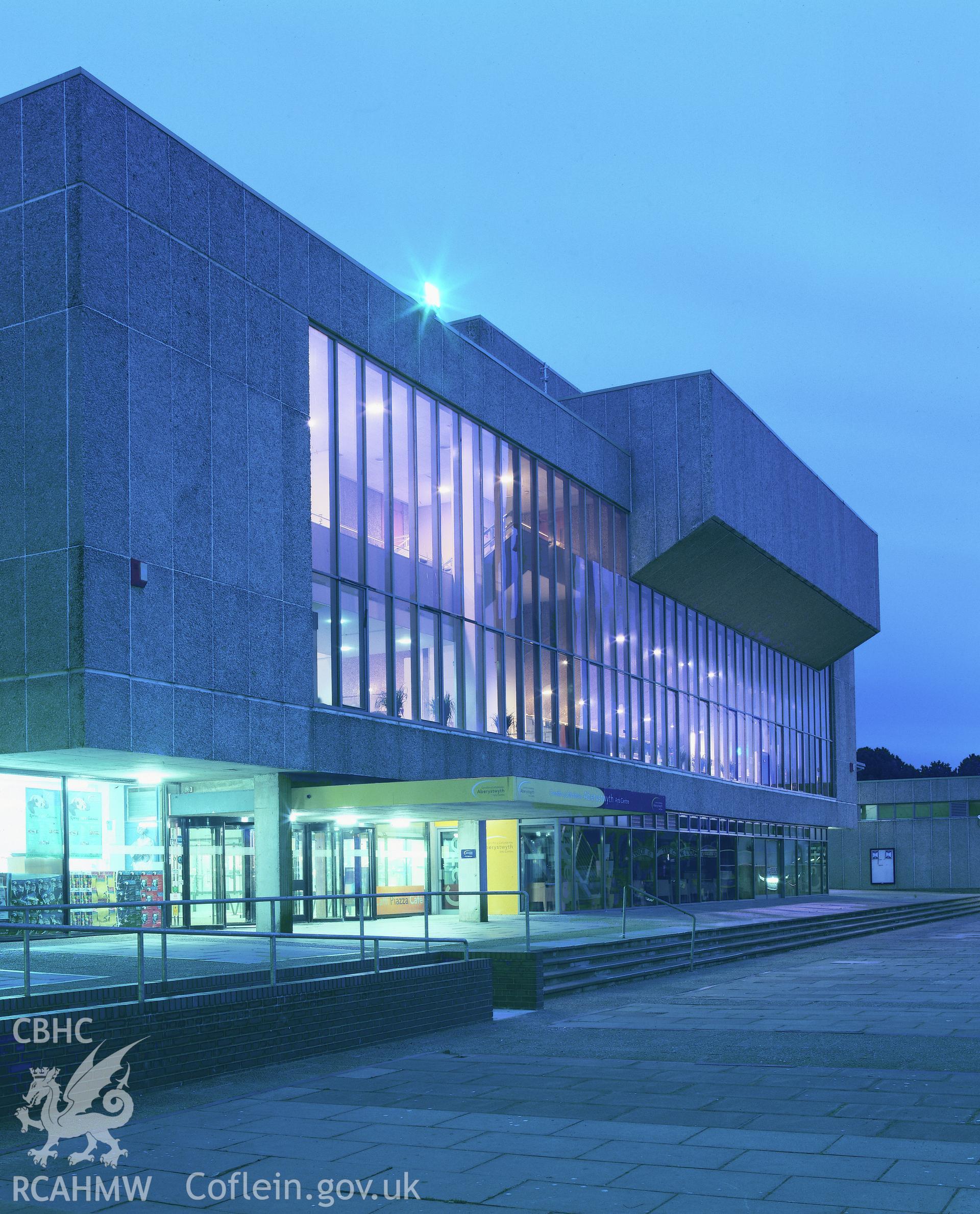 RCAHMW colour transparency showing view of Aberystwyth Arts Centre in the evening.