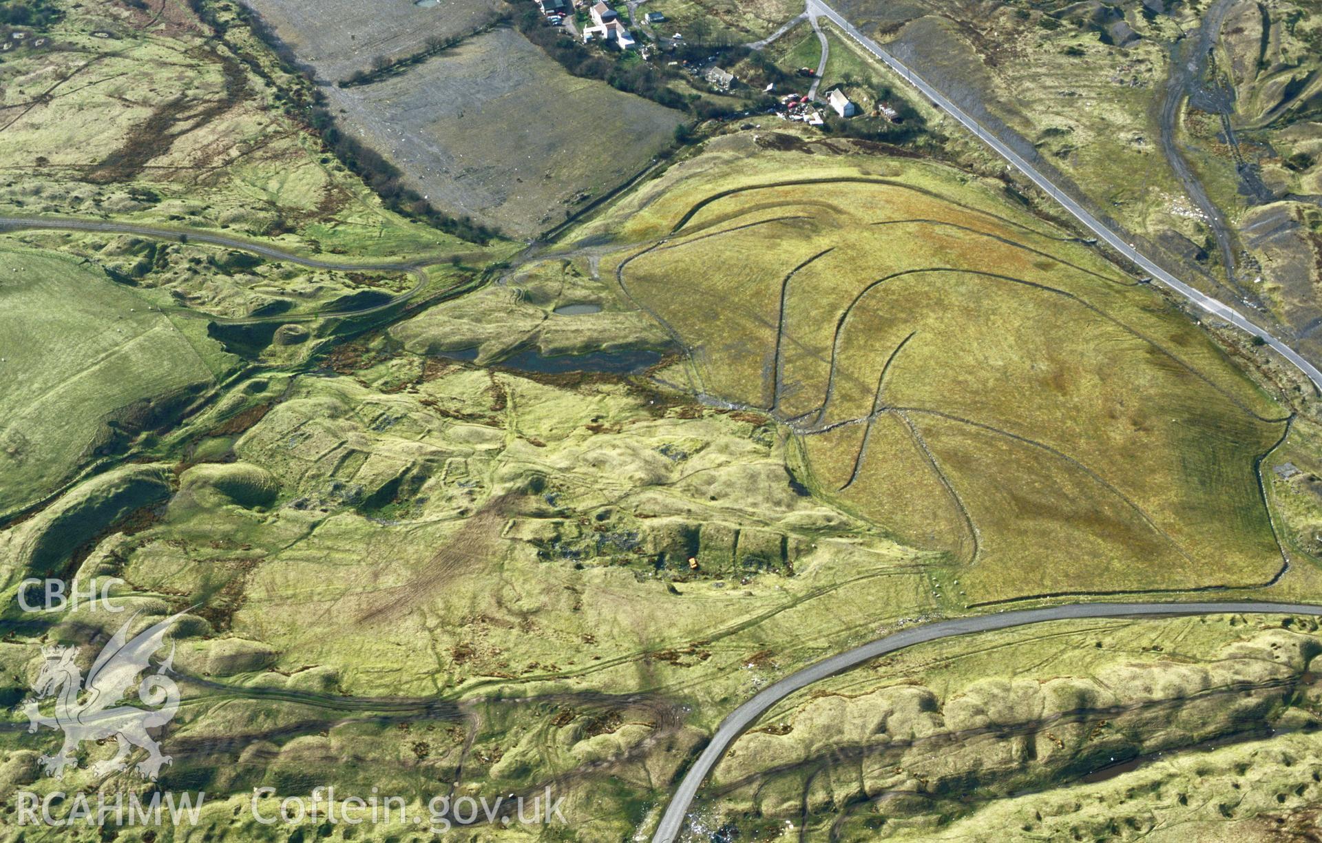 RCAHMW colour slide oblique aerial photograph of the deserted iron mining village, Ffos-y-fran, taken on 15/03/1999 by Toby Driver