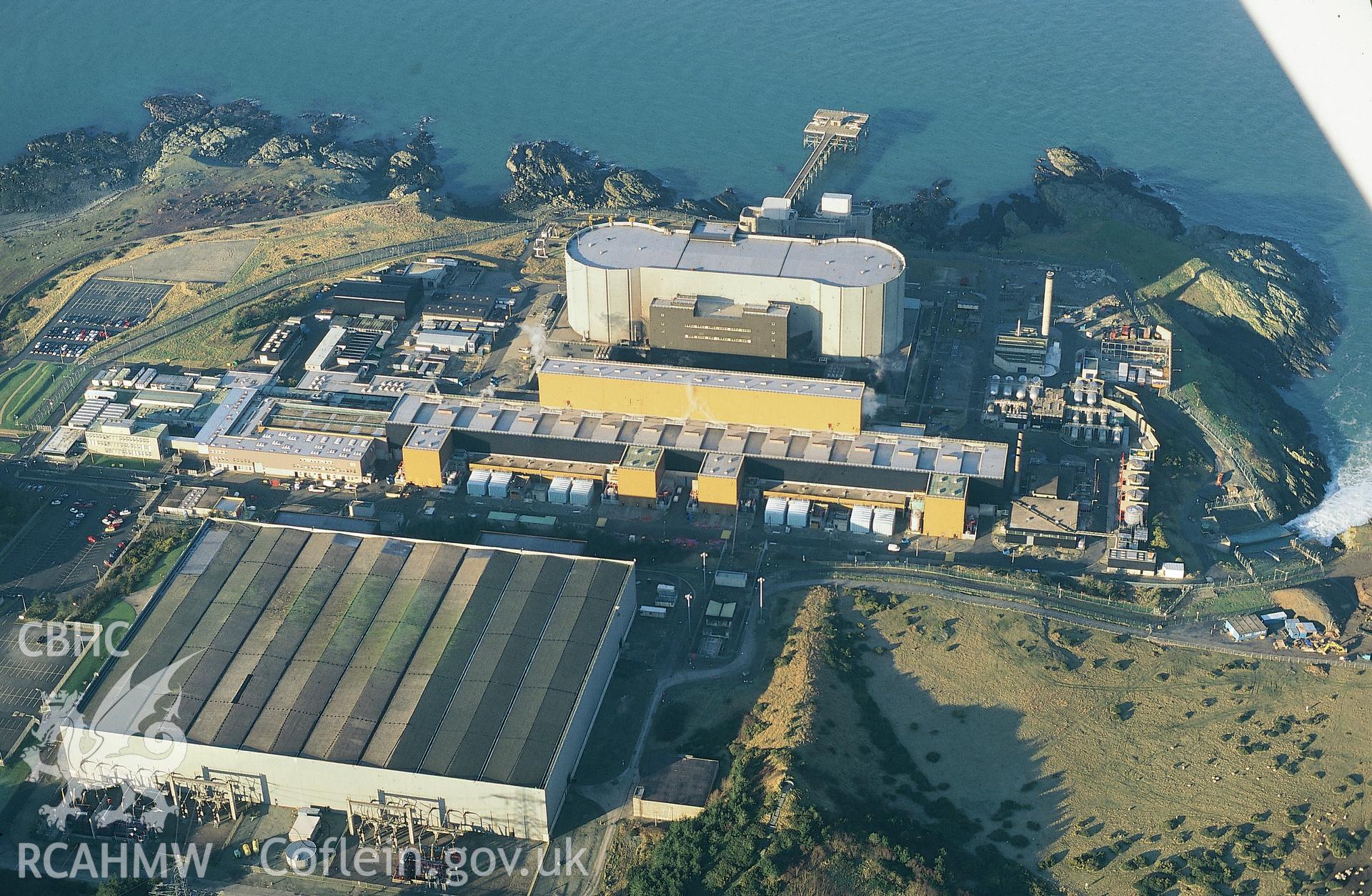 Slide of RCAHMW colour oblique aerial photograph of Wylfa Nuclear Power Station, taken by T.G. Driver, 10/1/1999.