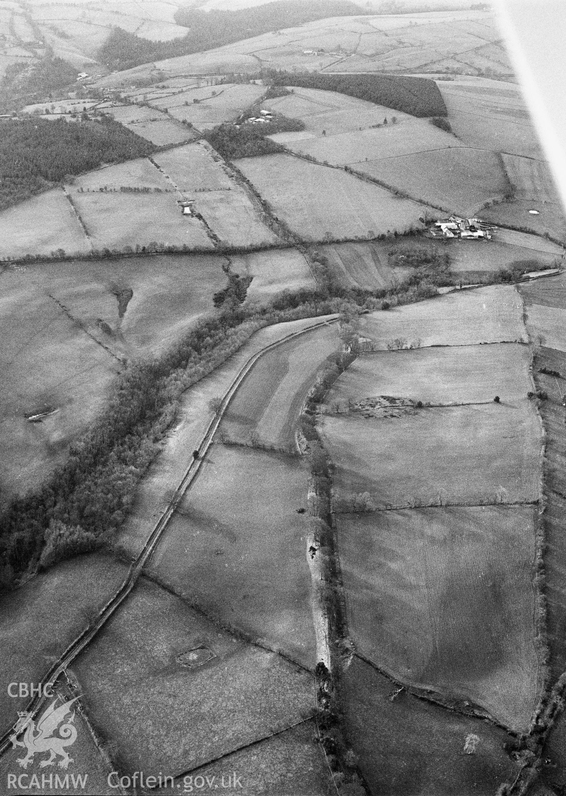 RCAHMW Black and white oblique aerial photograph of Offa's Dyke, Section From Footpath S Of Pen-y-bryn To Orseddwen, Glyntraian, taken by C.R. Musson, 23/01/94