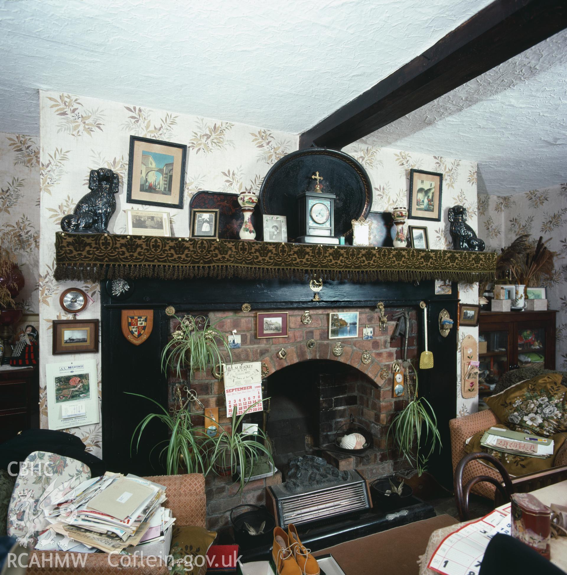 RCAHMW colour transparency showing the fireplace in the sitting room at Glan Ithon Farmhouse, taken by RCAHMW, undated.