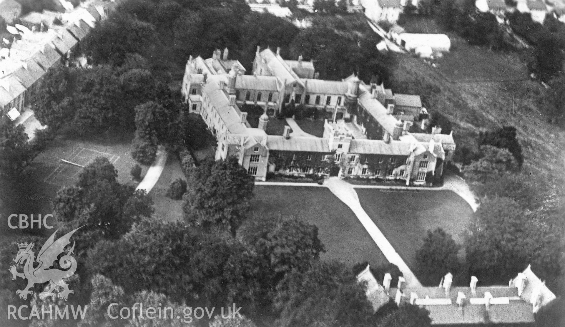 Digitised copy  of a postcard showing a black and white aerial photograph of St David's College, Lampeter, copied from a postcard from the personal postcard collection of C.S. Briggs.