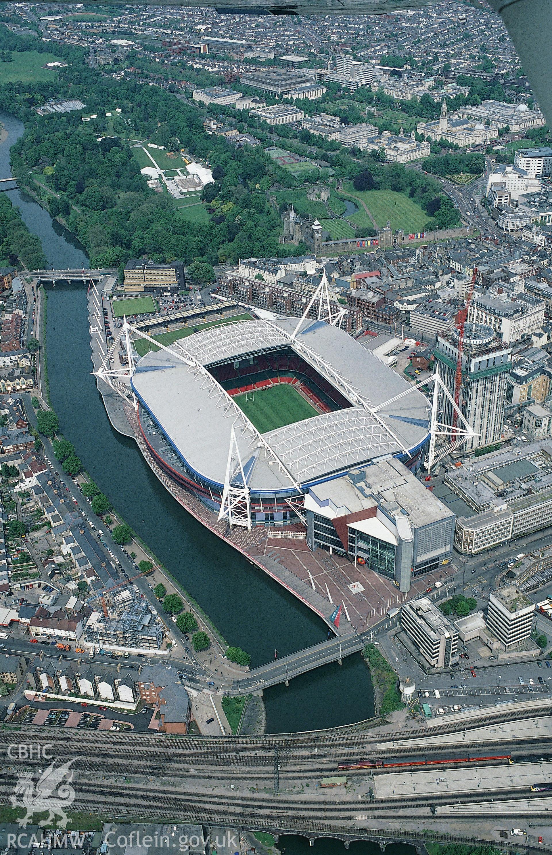 RCAHMW colour oblique aerial photograph of Cardiff, Millennium Stadium, and city centre. Taken by Toby Driver on 16/05/2002