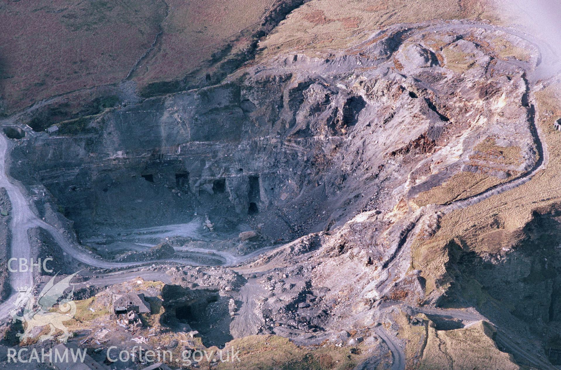 Slide of RCAHMW colour oblique aerial photograph of Llechwedd Slate Caverns, taken by C.R. Musson, 17/4/1994.