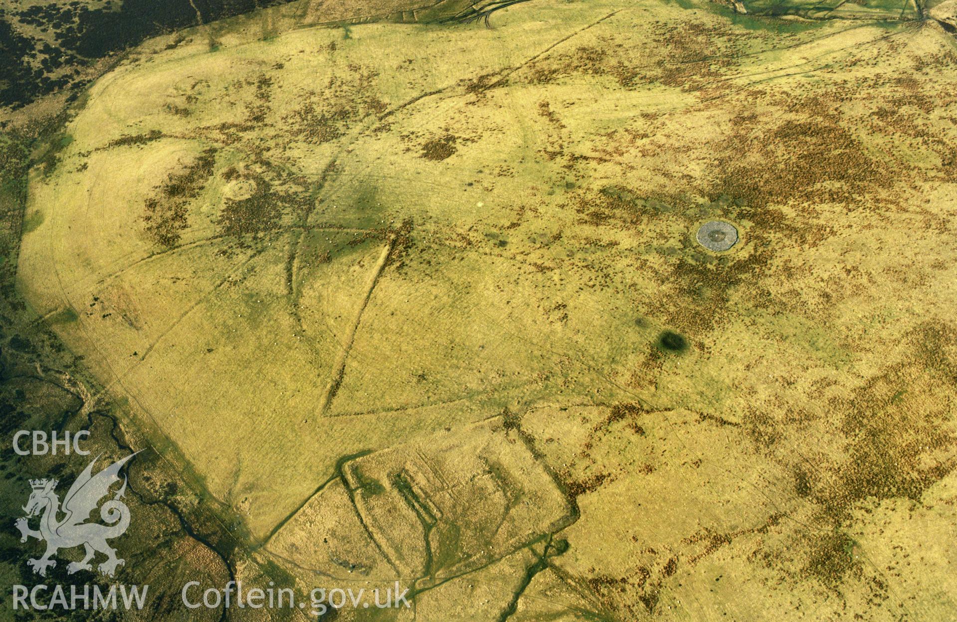 RCAHMW colour slide oblique aerial photograph of Hen Ddinbych, Llanrhaeadr-yng-nghinmeirch, taken on 26/02/1991 by CR Musson