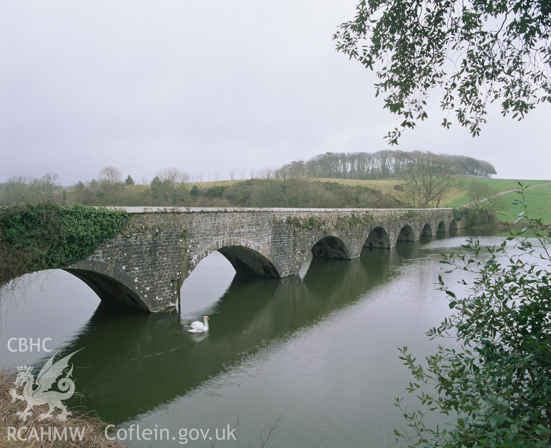 RCAHMW colour transparency showing view of eight arched bridge at Stackpole Court, taken by I.N. Wright, 2003.