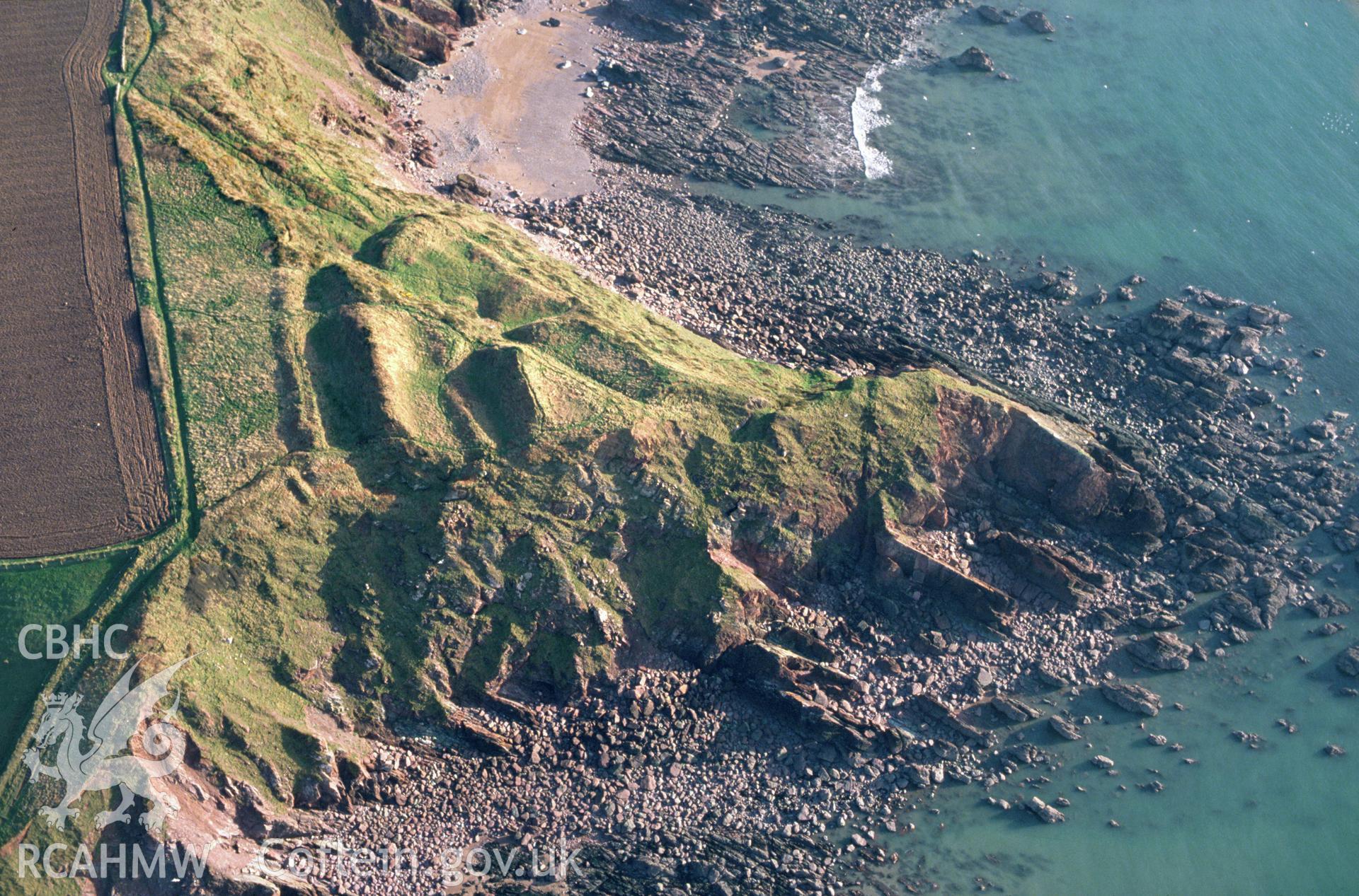 Slide of RCAHMW colour oblique aerial photograph of Great Castle Head Promontory Fort, taken by C.R. Musson, 23/2/1993.
