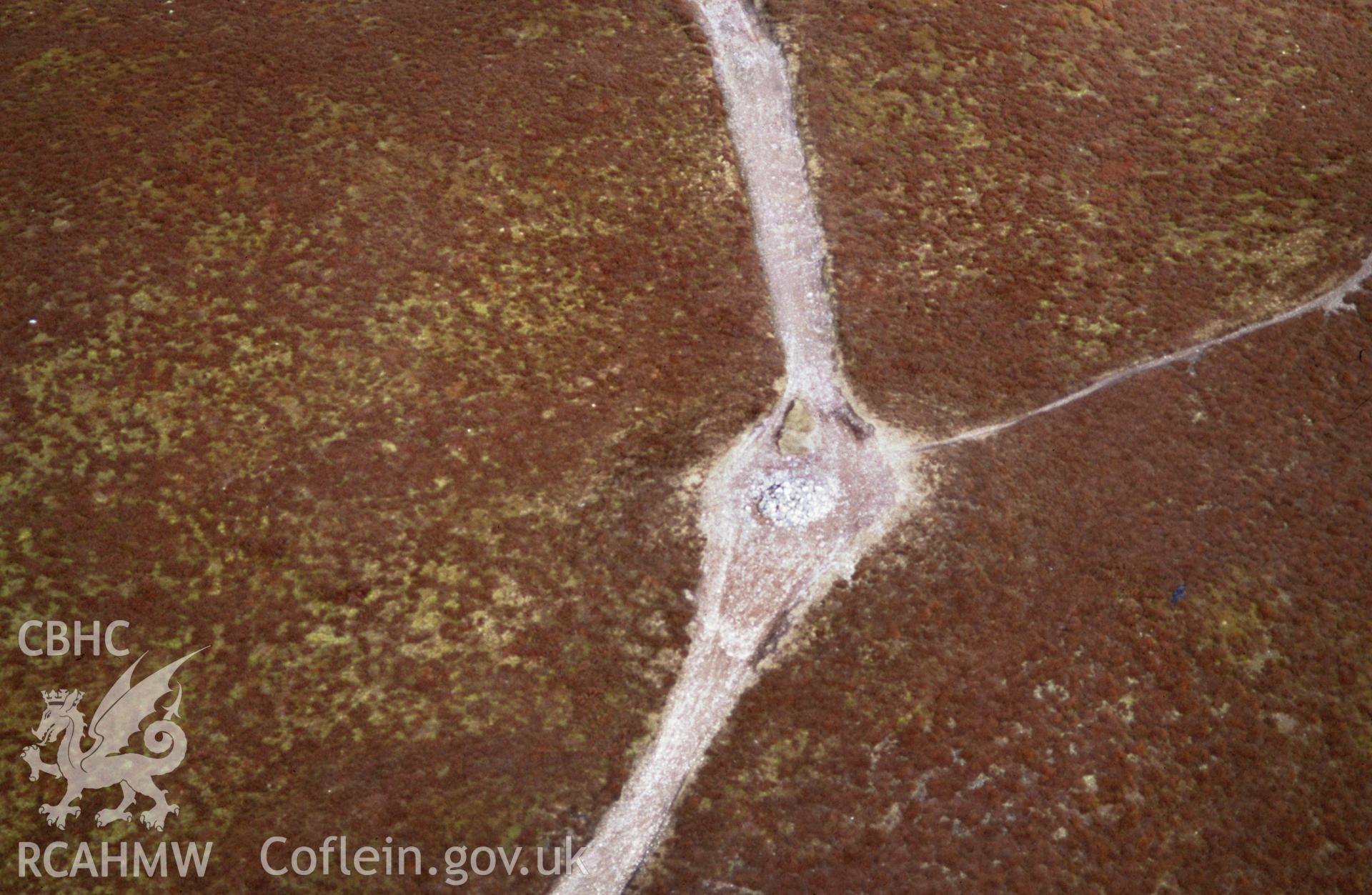Slide of RCAHMW colour oblique aerial photograph of Moel y Gamelin Cairn, Llantyssilio, taken by Toby Driver, 2001.