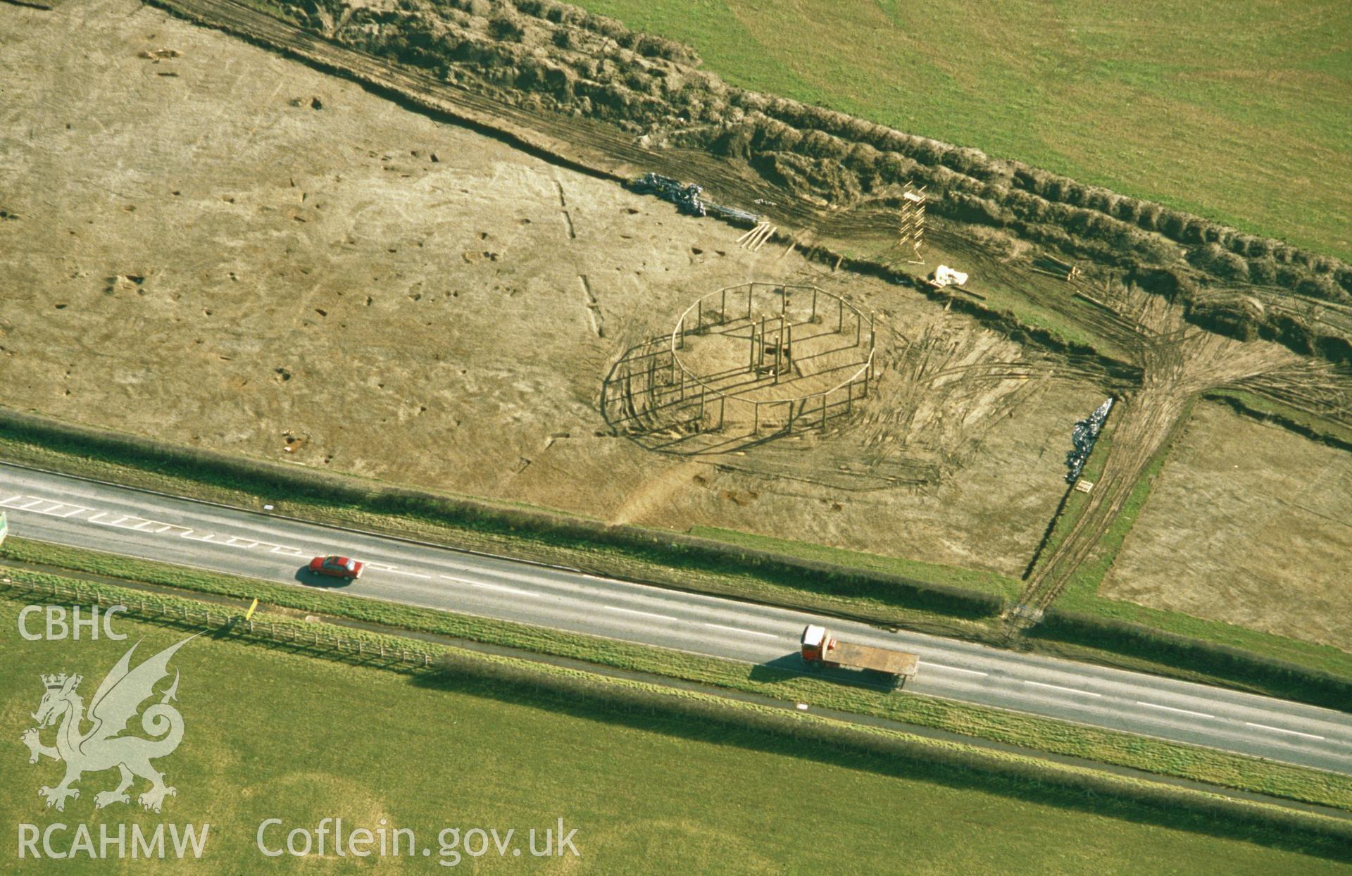 Slide of RCAHMW colour oblique aerial photograph of Sarn-y-bryn-Caled Pit Circle, taken by C.R. Musson, 26/2/1991.