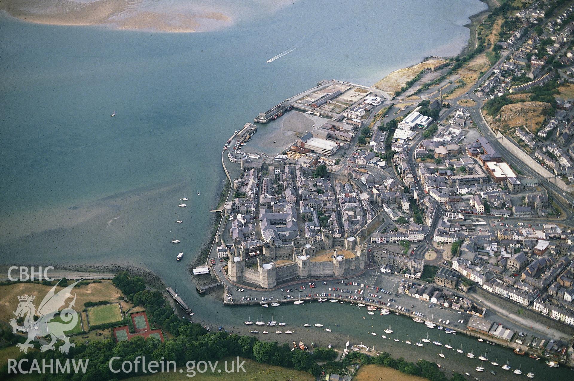 RCAHMW colour slide oblique aerial photograph of Caernarfon, Caernarfon, taken by C.R.Musson, 1990.