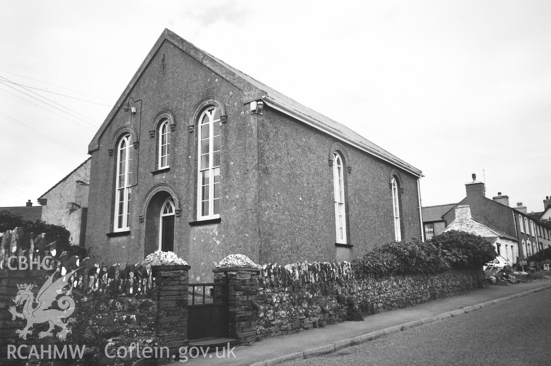 Digital copy of a black and white photograph showing a general view of Elim Baptist Chapel, Trevine, taken by Robert Scourfield, 1995.