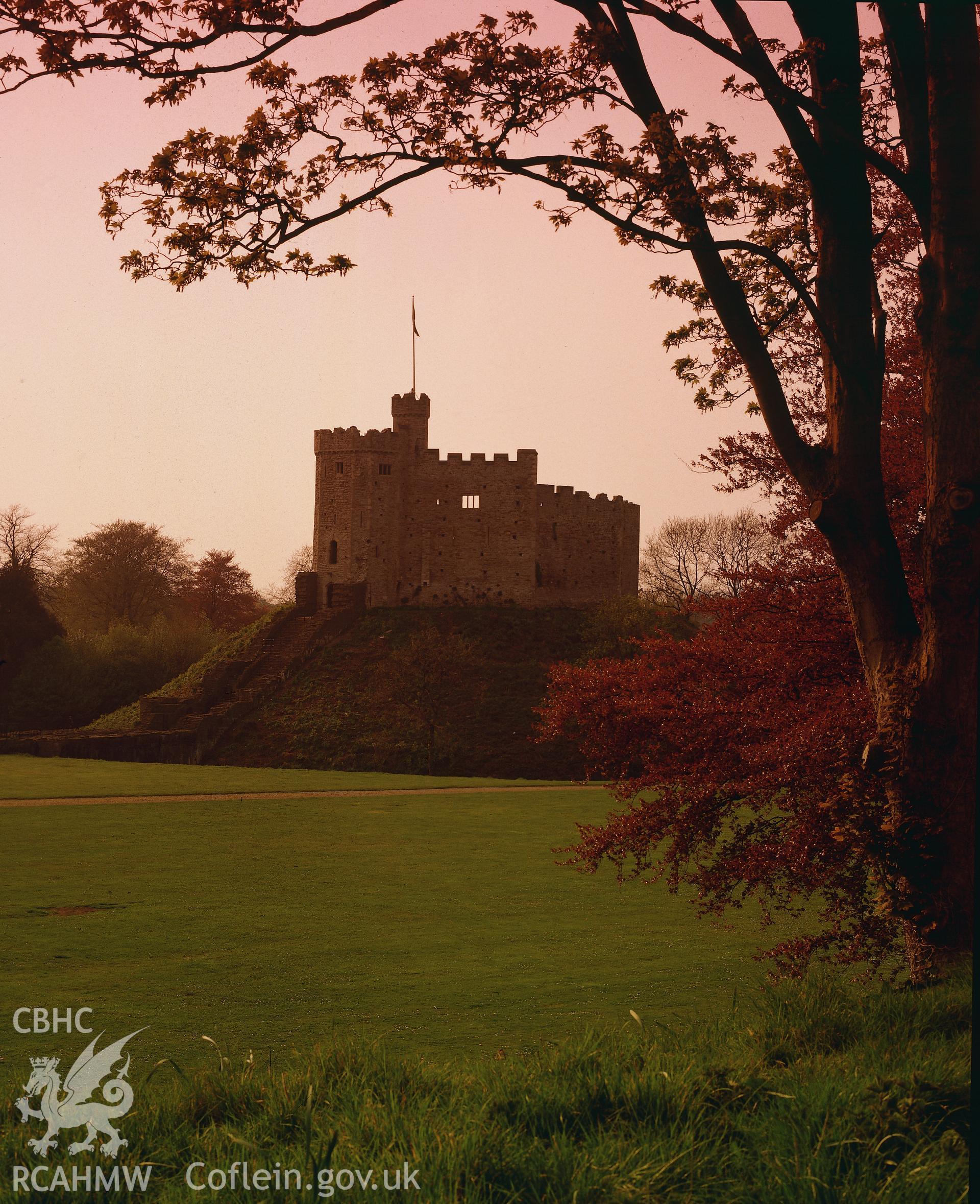 RCAHMW colour transparency of a general exterior view of Cardiff Castle at sunset.