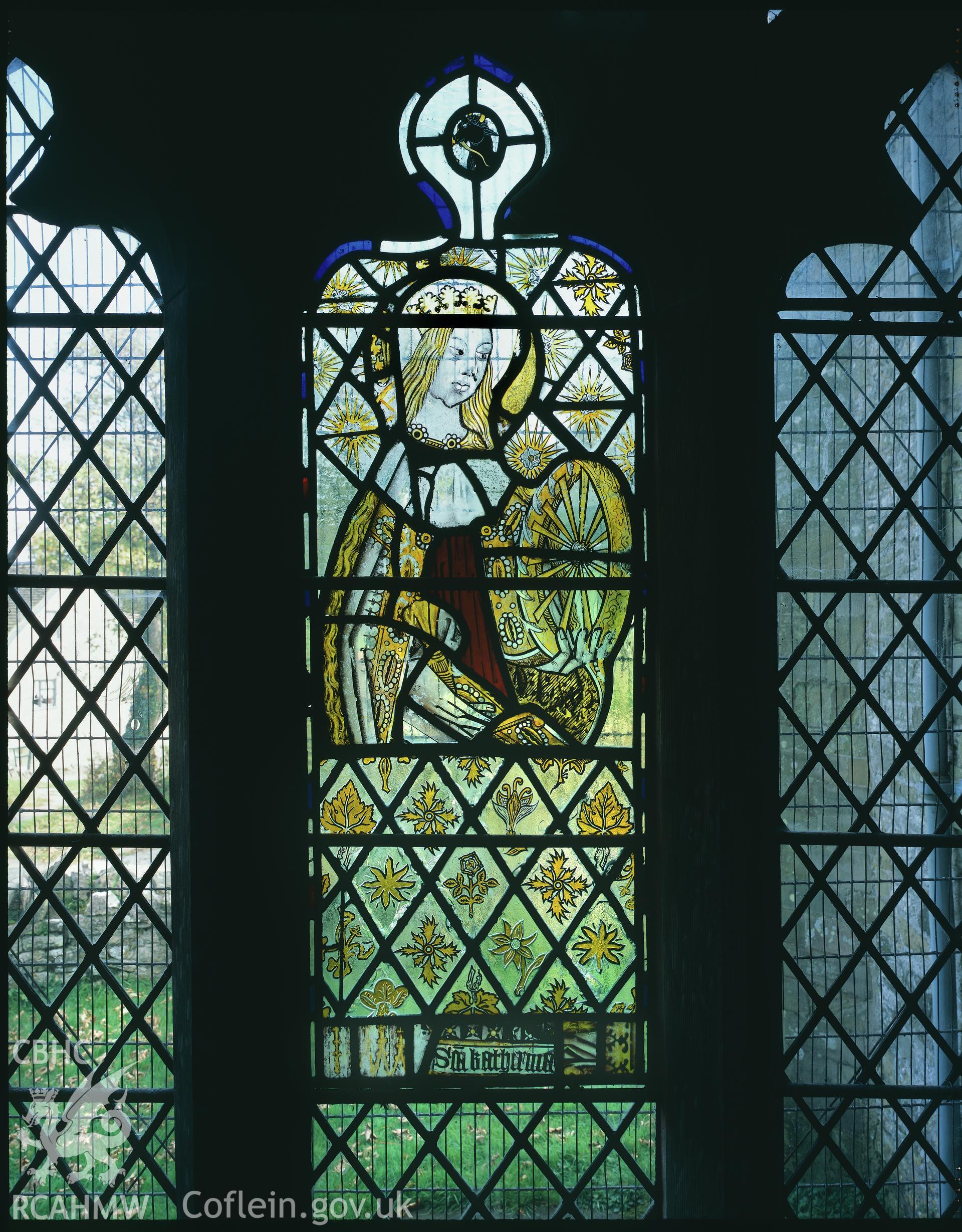 RCAHMW colour transparency of a stained glass window in Old Radnor Church, depicting St. Katherine.