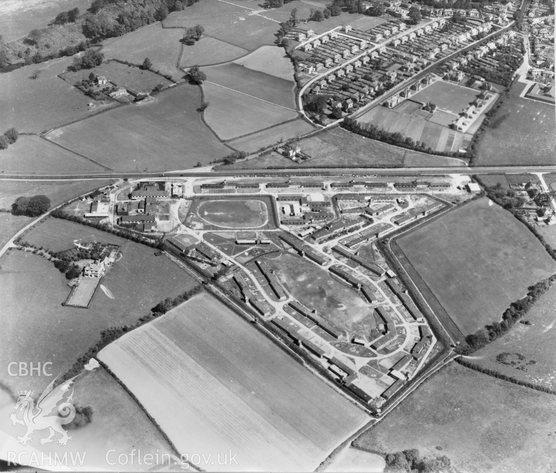 Black and white oblique aerial photograph showing Bridgend Island Farm Prisoner of War Camp, from Aerofilms album no W18 (Glamorgan A-B), taken by Aerofilms Ltd and dated 1947.