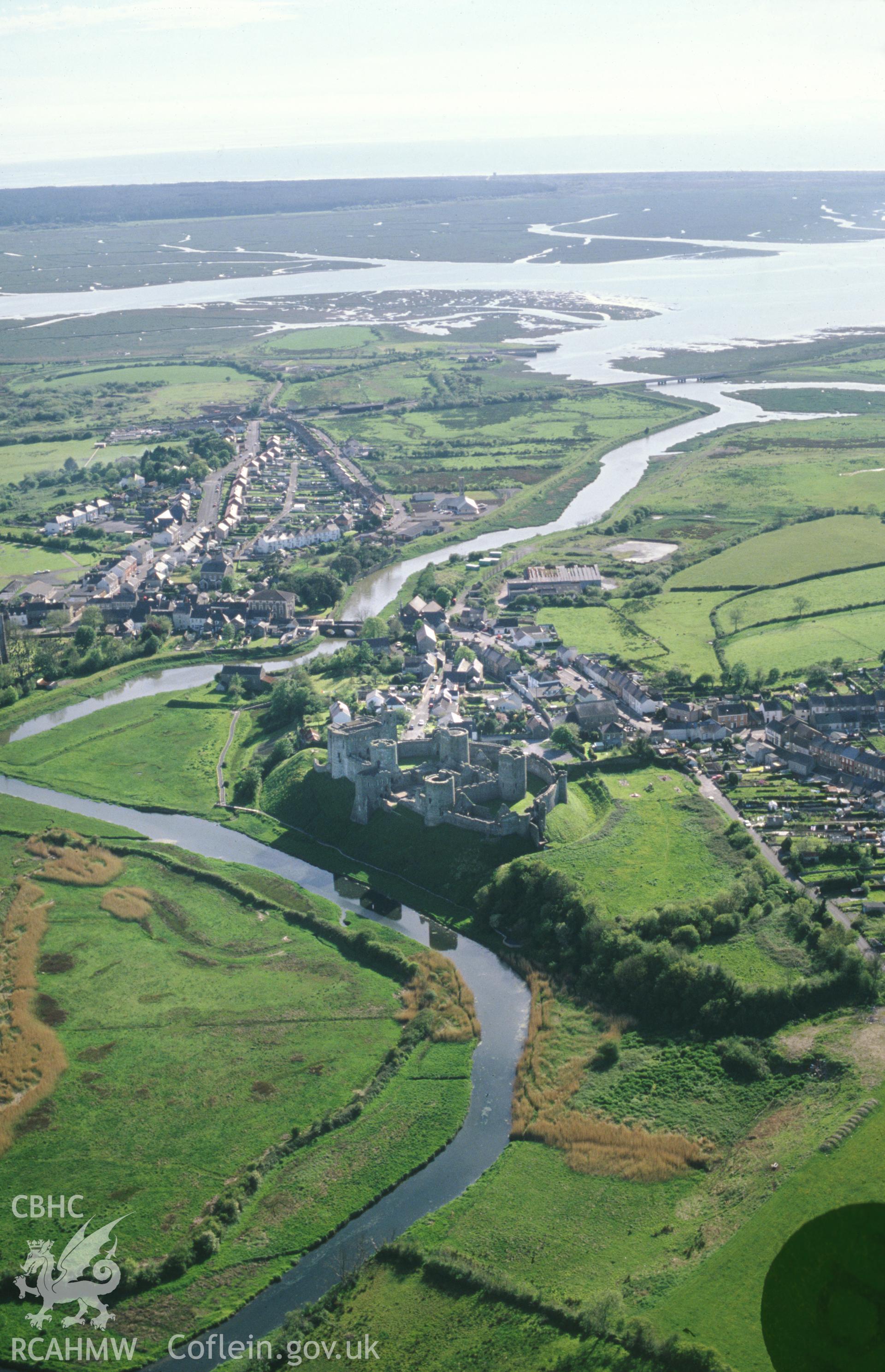 Slide of RCAHMW colour oblique aerial photograph of Kidwelly Town, taken by C.R. Musson, 18/5/1989.