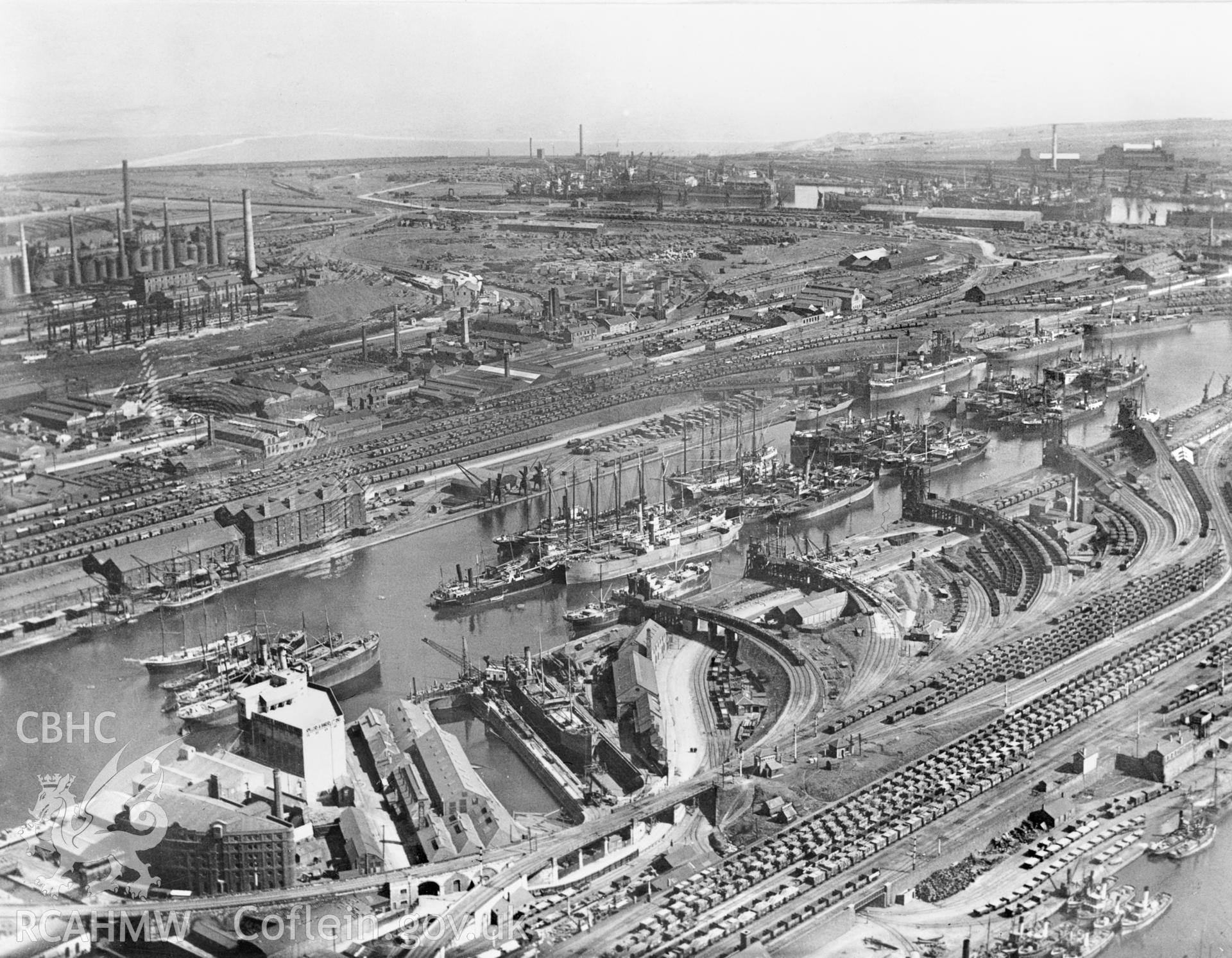 Black and white oblique aerial photograph showing Cardiff Docks, from Aerofilms album no W22 (Glamorgan Cardiff), taken by Aerofilms Ltd and dated 1921.