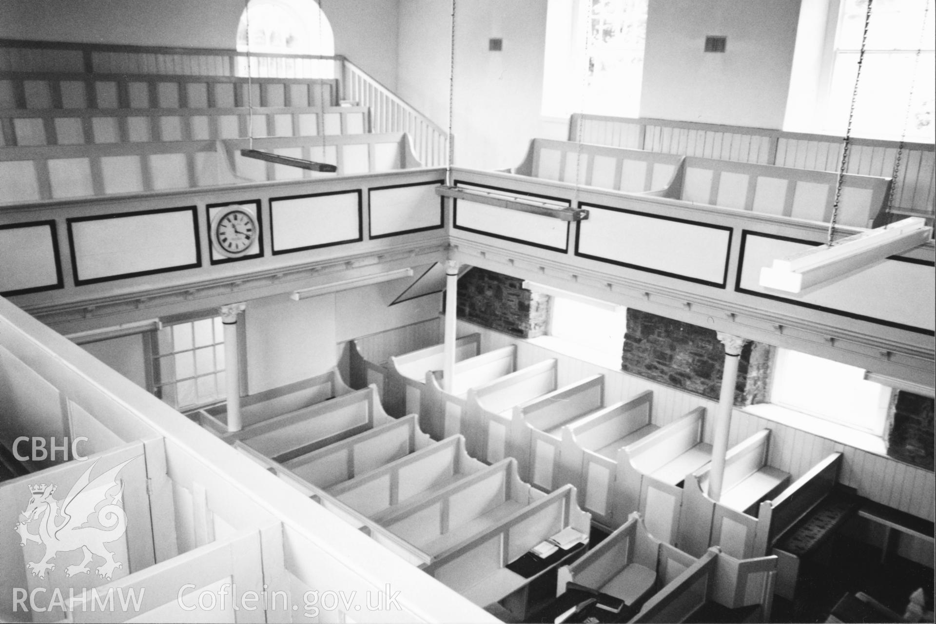 Digital copy of a black and white photograph showing an interior view of Rhydyceisiad Welsh Independent Chapel,  taken by Robert Scourfield, 1996.