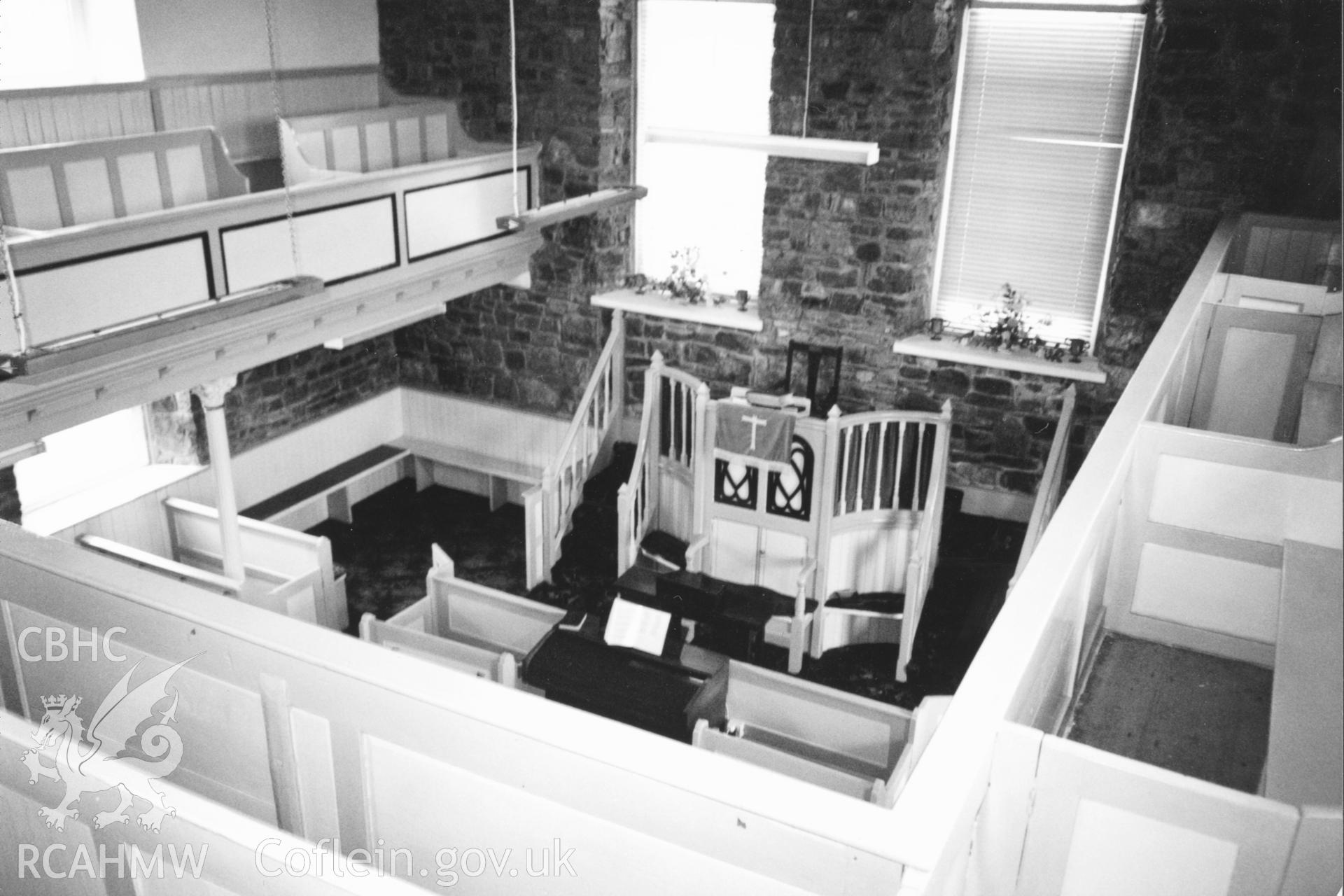 Digital copy of a black and white photograph showing an interior view of Rhydyceisiad Welsh Independent Chapel,  taken by Robert Scourfield, 1996.