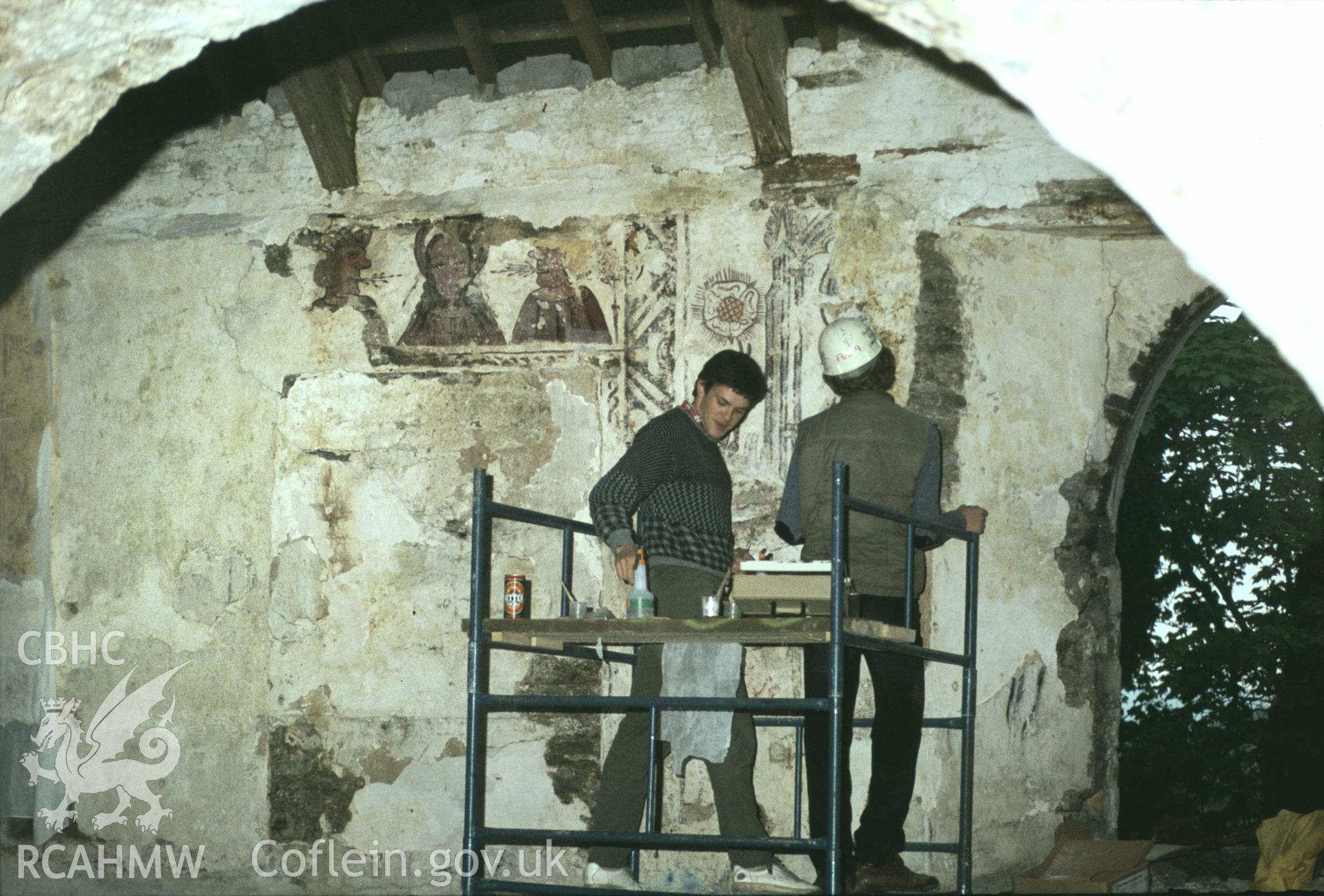 RCAHMW colour transparency showing conservationists at work on the wallpaintings at St Teilo's Church, Llandeilo Talybont, photographed in 1984.
