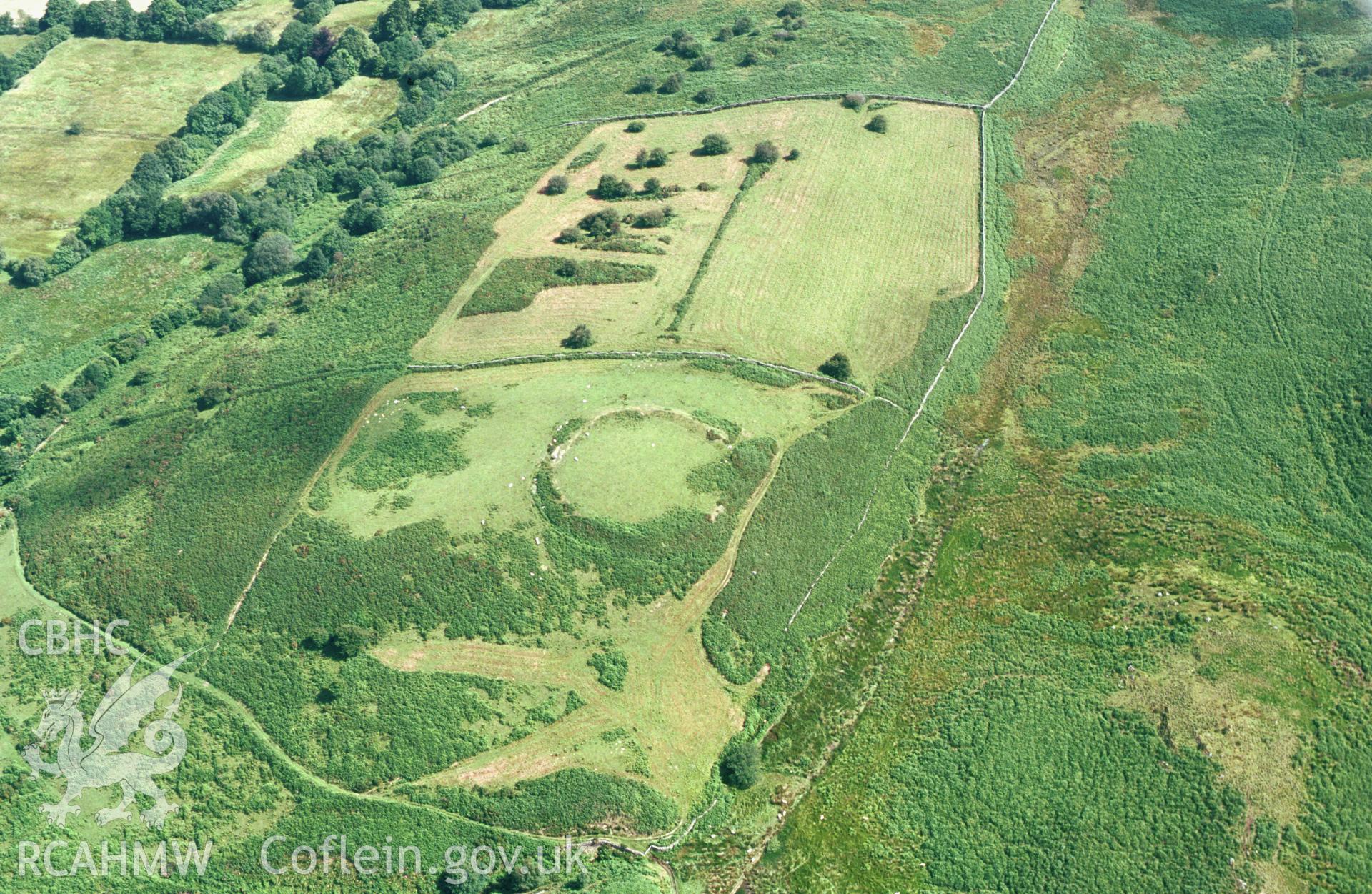 Slide of RCAHMW colour oblique aerial photograph of the enclosure at Gardden enclosure, Llanerfyl aken by T.G. Driver, 2001.