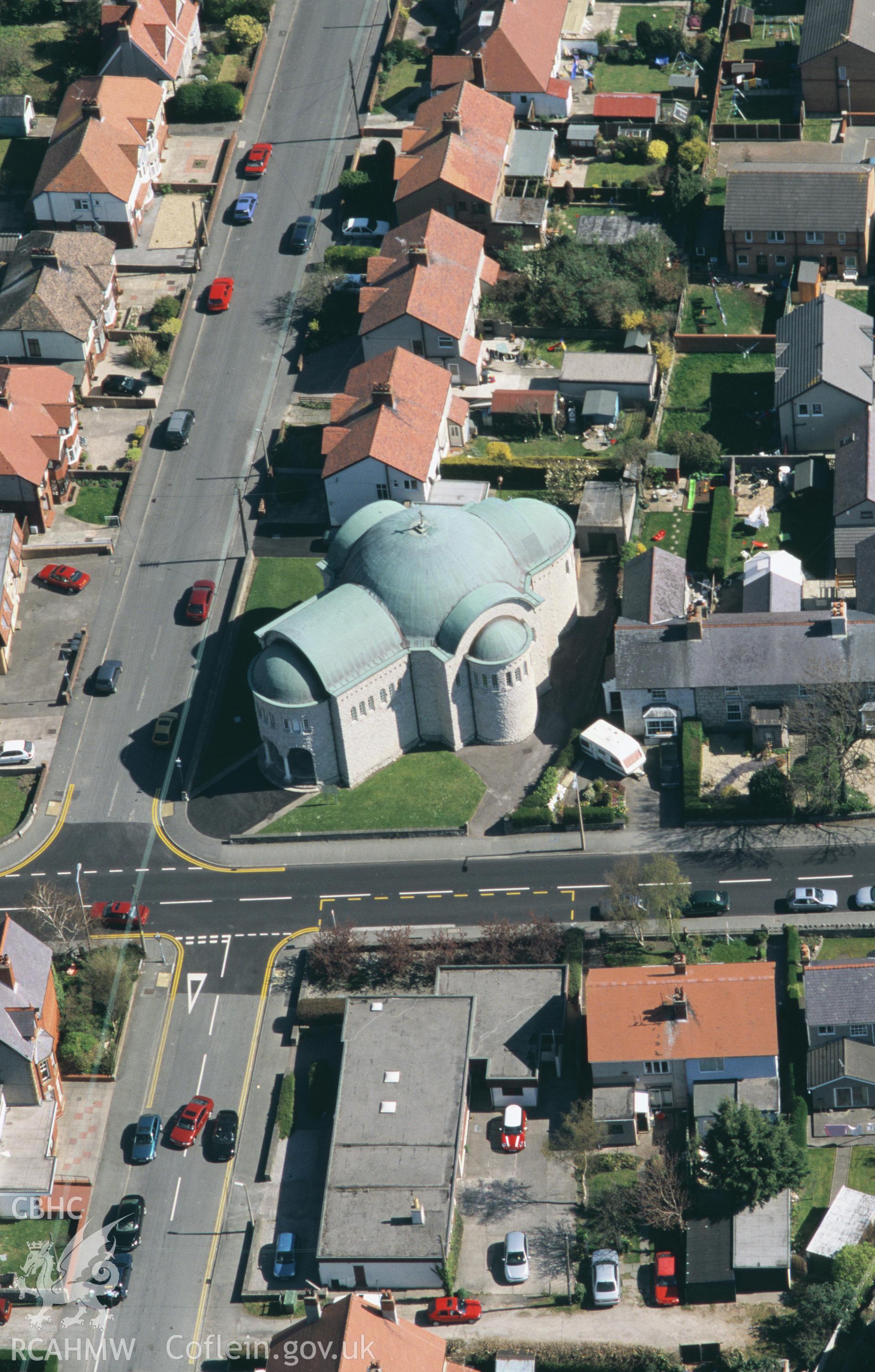 RCAHMW colour oblique aerial photograph of St. Teresa of Lisieux Catholic Church, Abergele, and housing. Taken by Toby Driver on 08/04/2003