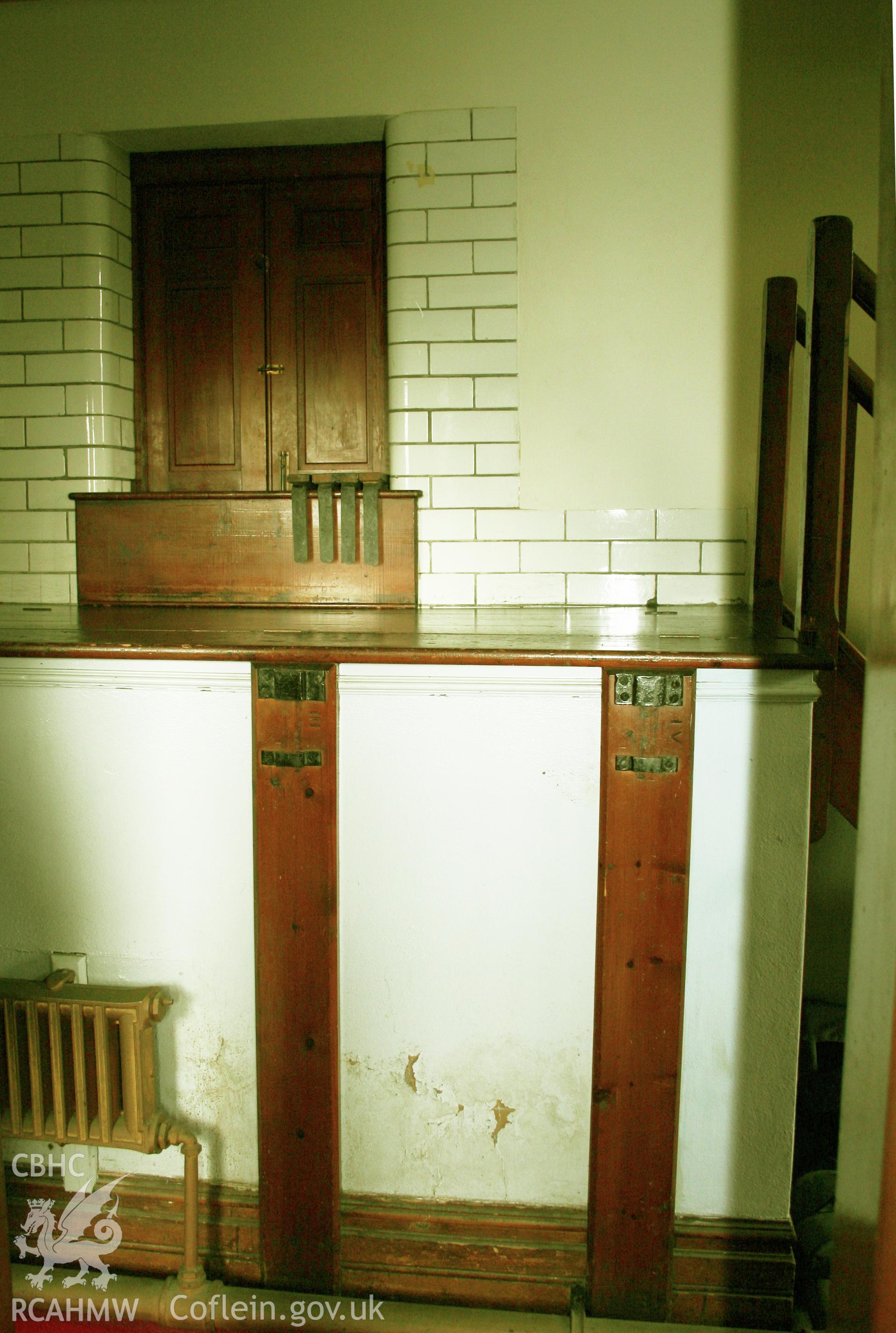 Baptismal tank at rear with access through doorway to pulpit.
