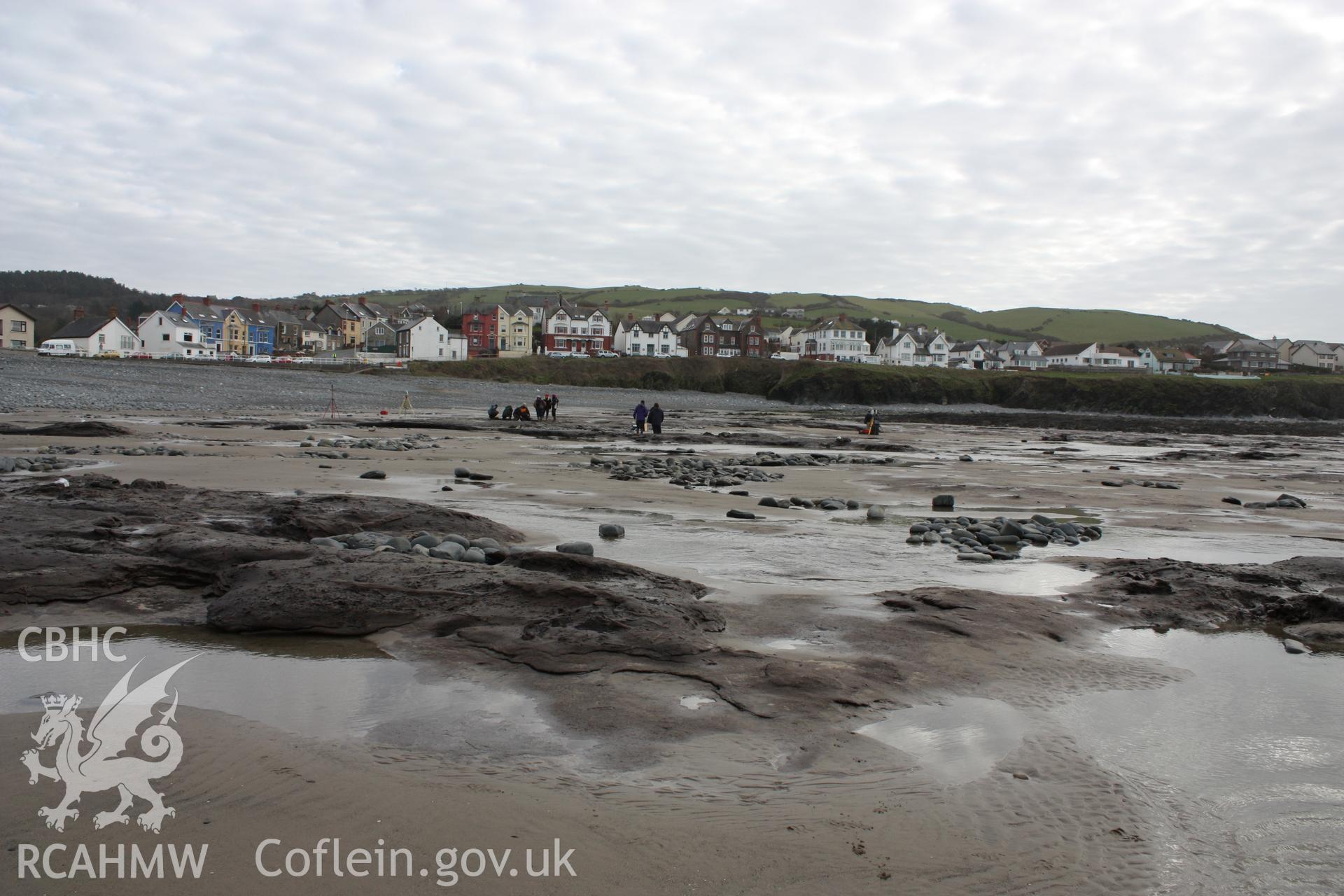 Borth submerged forest (between RNLI lifeboat station and upper Borth), looking east towards High Street. Showing extent of peat exposures at low tide.