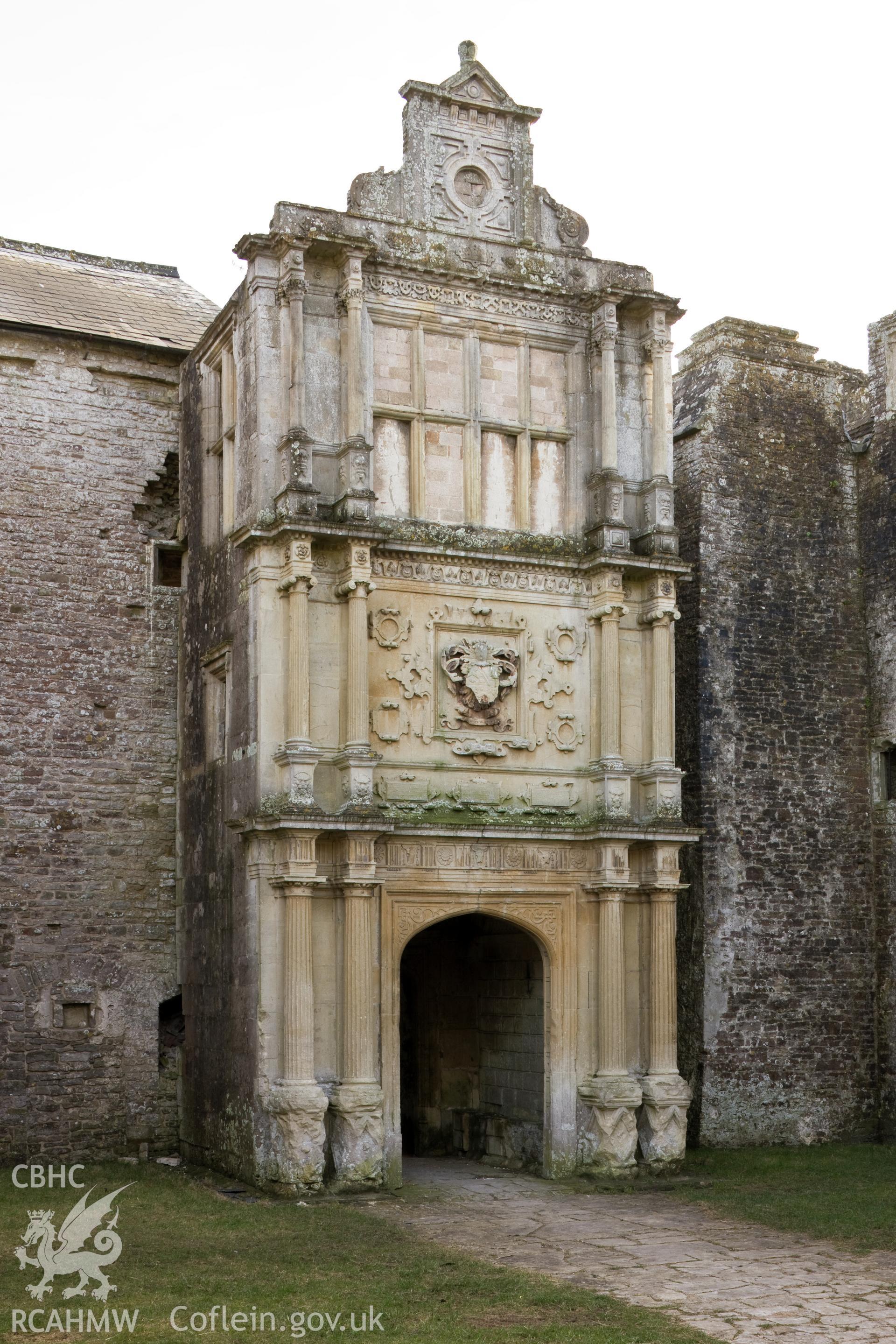 Close, low view of entrance porch from the north northeast.