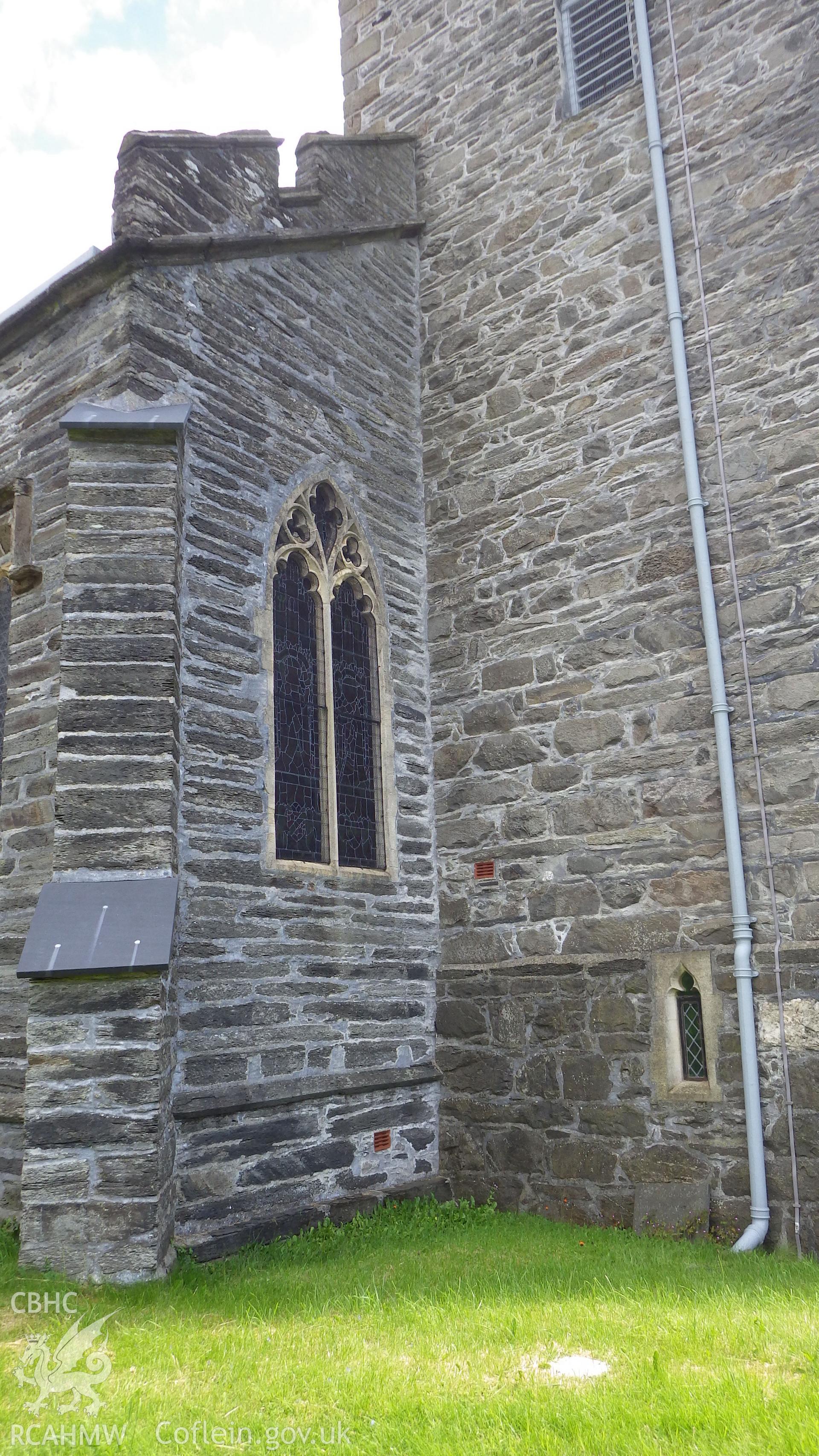 Northern facade - join of tower to the main body of the church showing difference in stonework