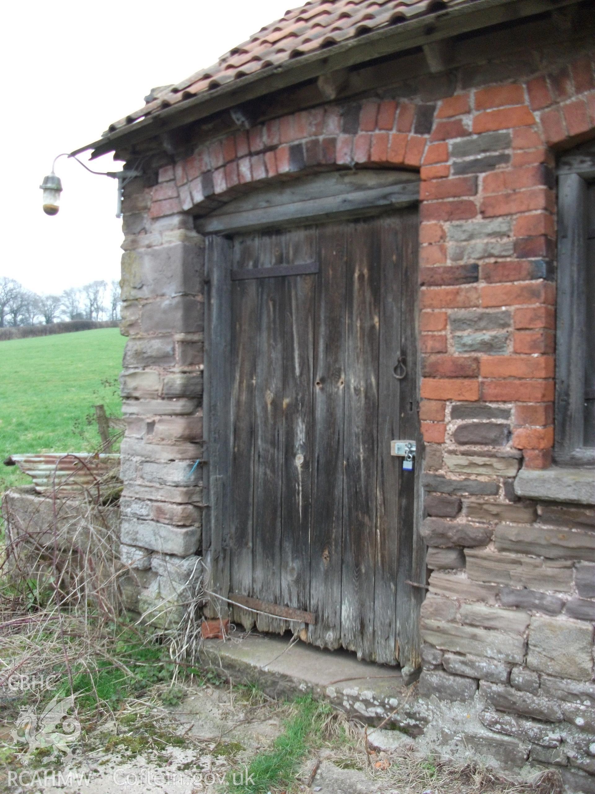 Colour digital photograph of exterior of barn  - entrance; at Llangwm Isaf Farm, received in the course of Emergency Recording case ref no RCS2/1/1599.