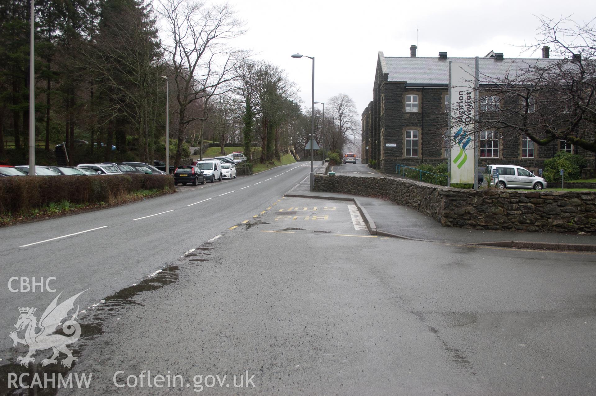 Marian Mawr archaeological assessment; section G-H,  from E, view along street at Coleg Meirion Dwyfor, with pipeline route under pavement,  taken by Robert Evans of Gwynedd Archaeological Trust, 5th February 2016.