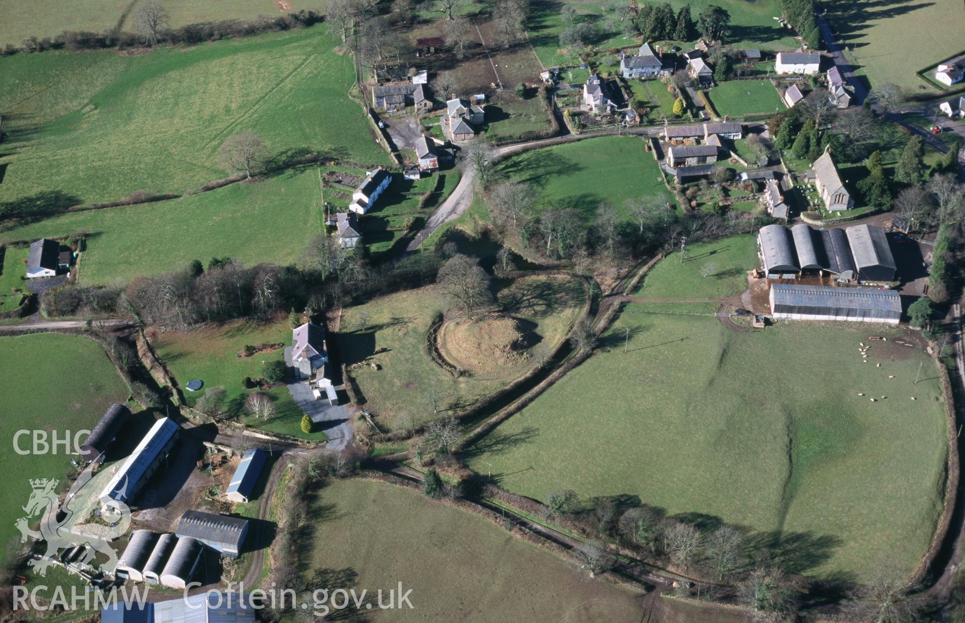 Slide of RCAHMW colour oblique aerial photograph of Kinnerton Court, Motte;kinnerton Castle, taken by T.G. Driver, 16/2/2001.