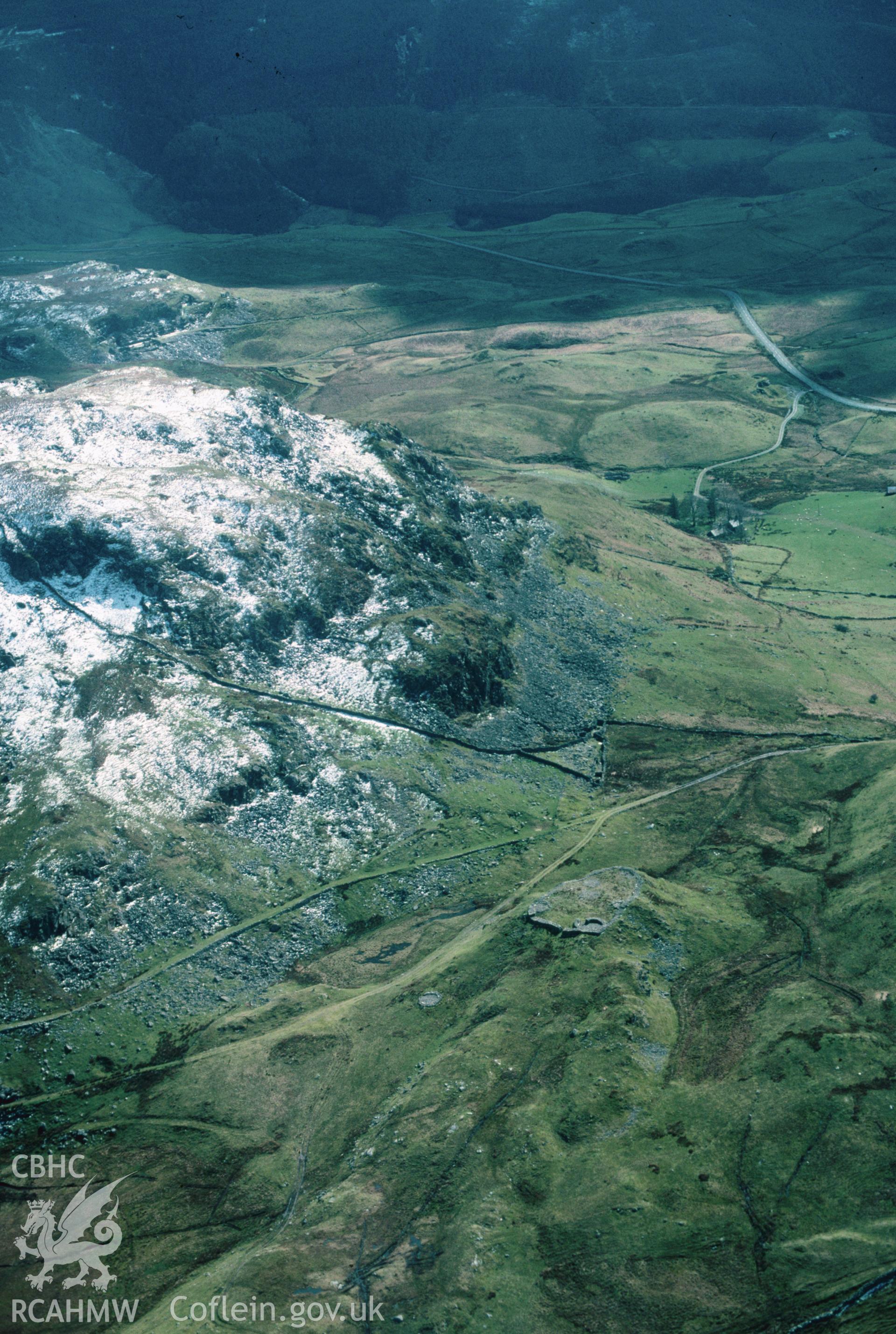 Slide of RCAHMW colour oblique aerial photograph of Bryn-y-castell Hill Fort, taken by C.R. Musson, 4/4/1990.
