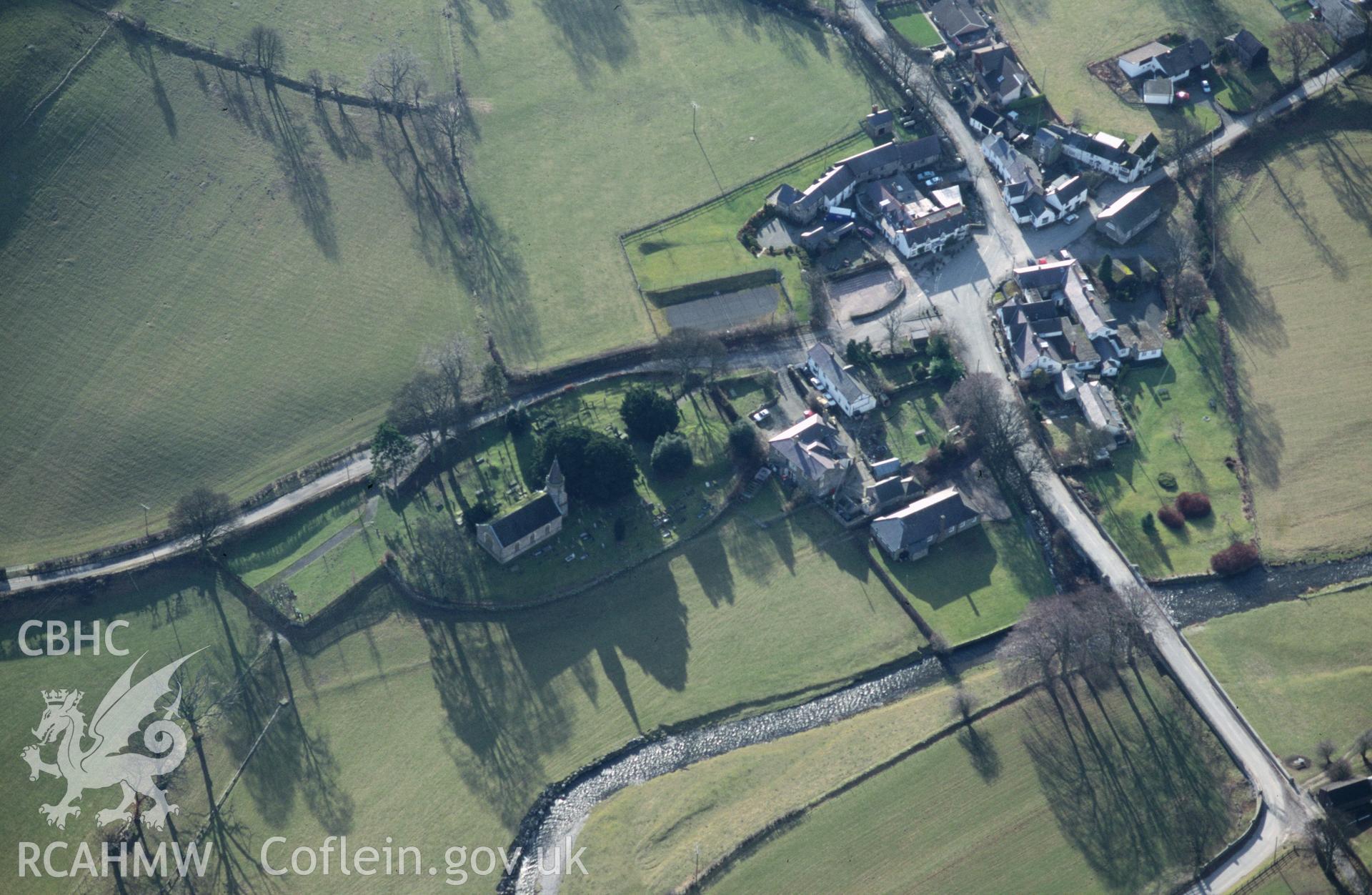 Slide of RCAHMW colour oblique aerial photograph of Llanarmon Dyffryn Ceiriog, taken by C.R. Musson, 14/2/1997.
