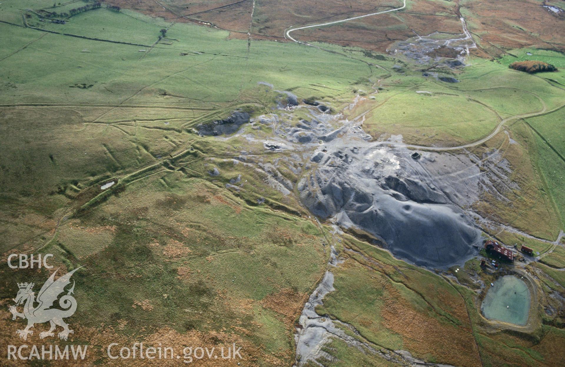 Slide of RCAHMW colour oblique aerial photograph of Esgairmwyn Lead Mine, Mine Workings Complex, taken by C.R. Musson, 29/10/1992.