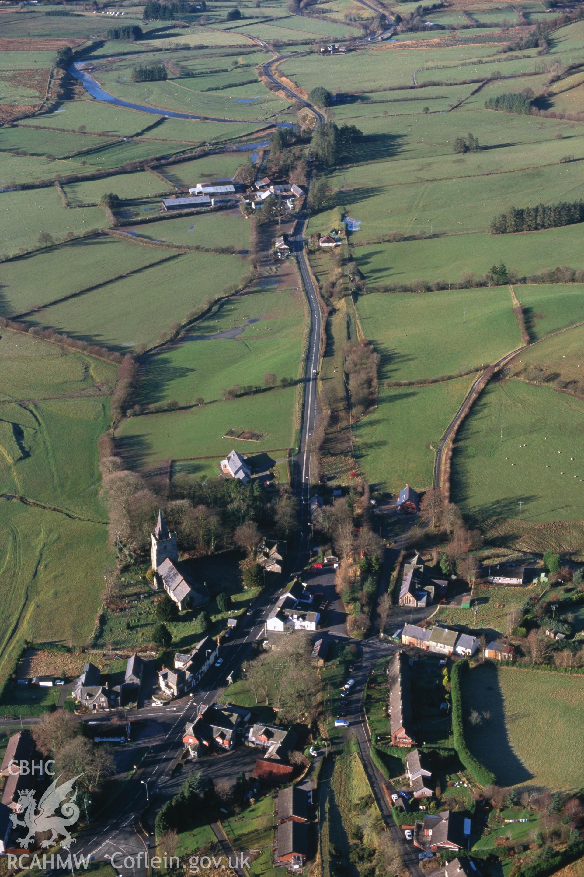 Slide of RCAHMW colour oblique aerial photograph of Llangurig, taken by C.R. Musson, 20/12/1998.
