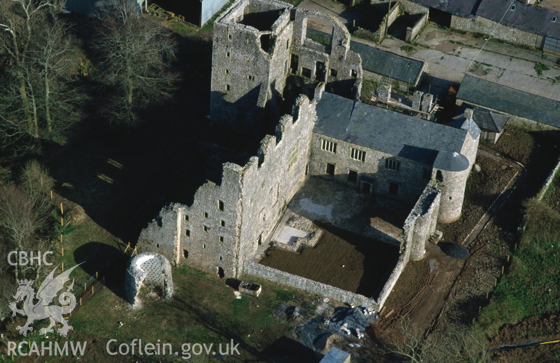 RCAHMW colour slide oblique aerial photograph of Oxwich Castle, Penrice, taken by C.R. Musson, 29/03/94