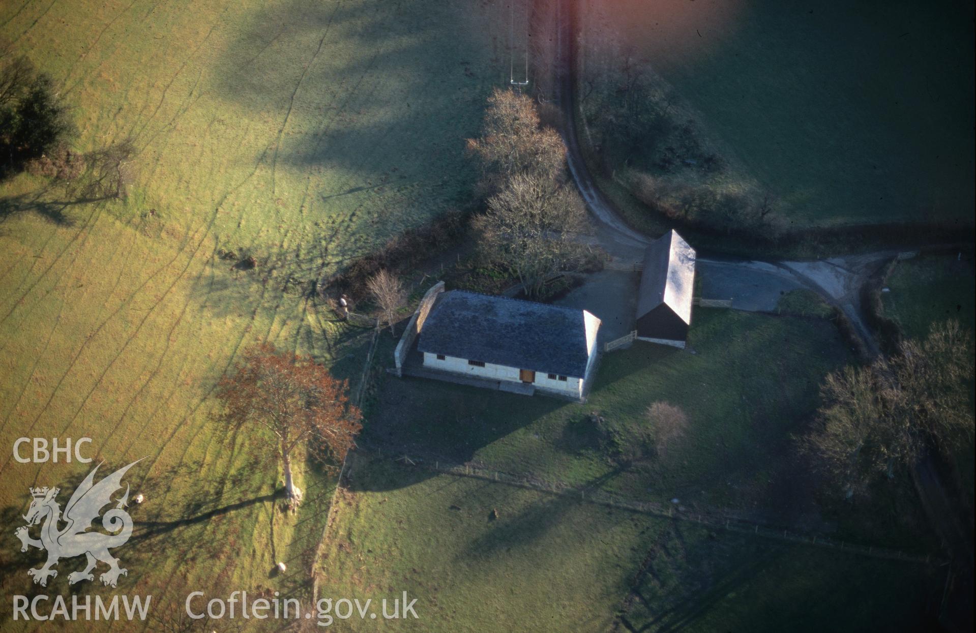 Slide of RCAHMW colour oblique aerial photograph of Ty Mawr, Castle Caereinion, taken by C.R. Musson, 20/12/1998.