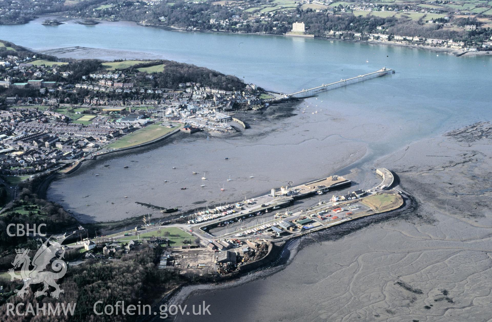 RCAHMW colour slide oblique aerial photograph of Porth Penrhyn, Llandygai, taken by C.R.Musson on the 14/02/1996