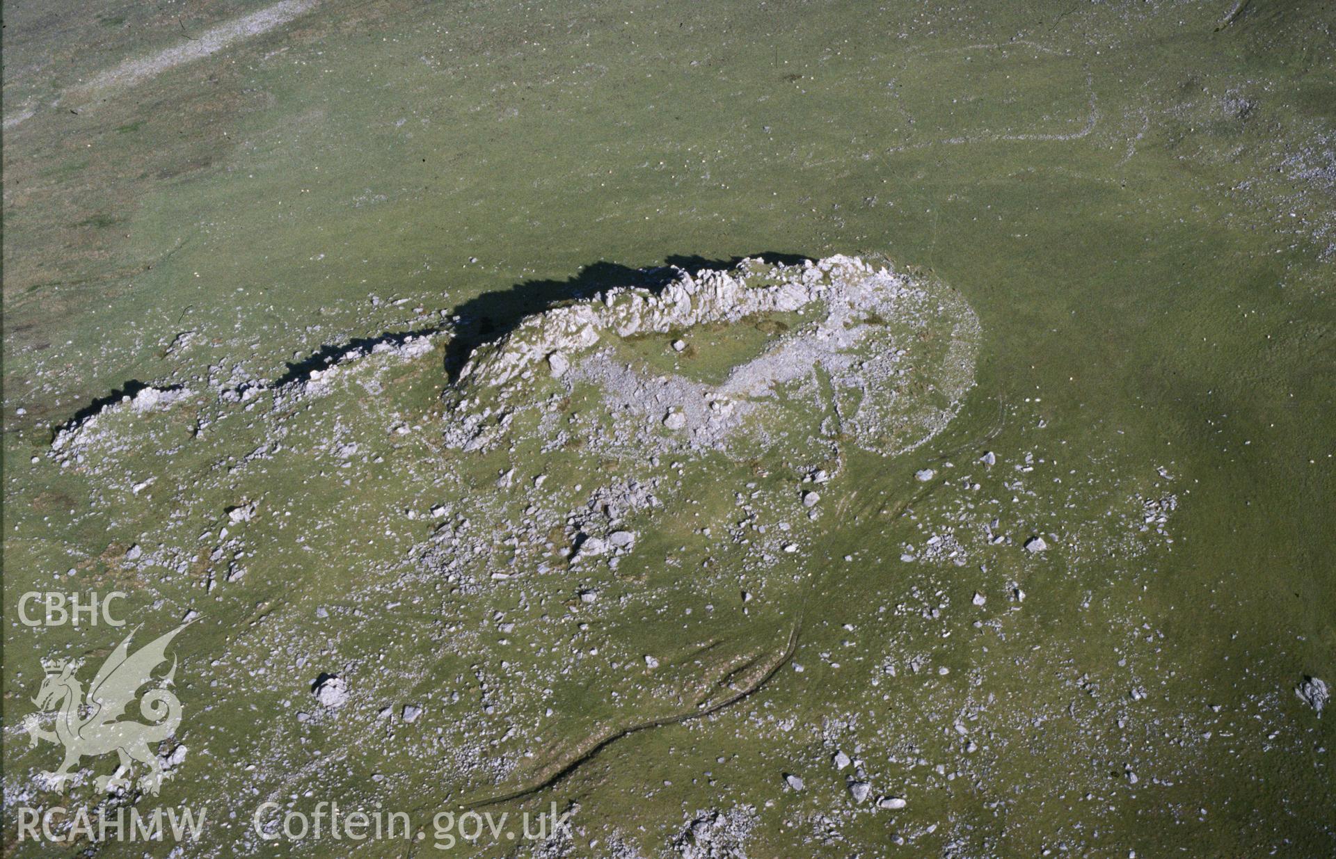 Slide of RCAHMW colour oblique aerial photograph of Carn Alw Hillfort, taken by C.R. Musson, 2/7/1990.
