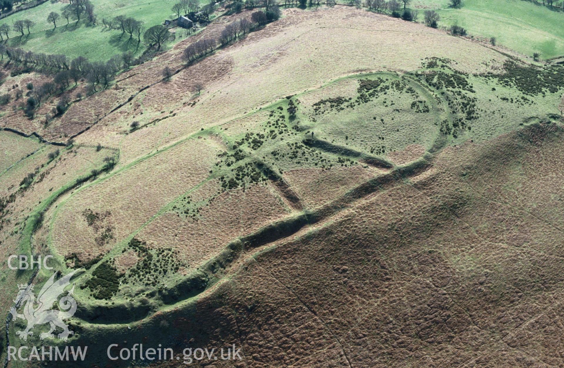 RCAHMW colour slide oblique aerial photograph of Twyn-y-gaer Camp, Crucorney, taken by C.R. Musson, 26/03/94