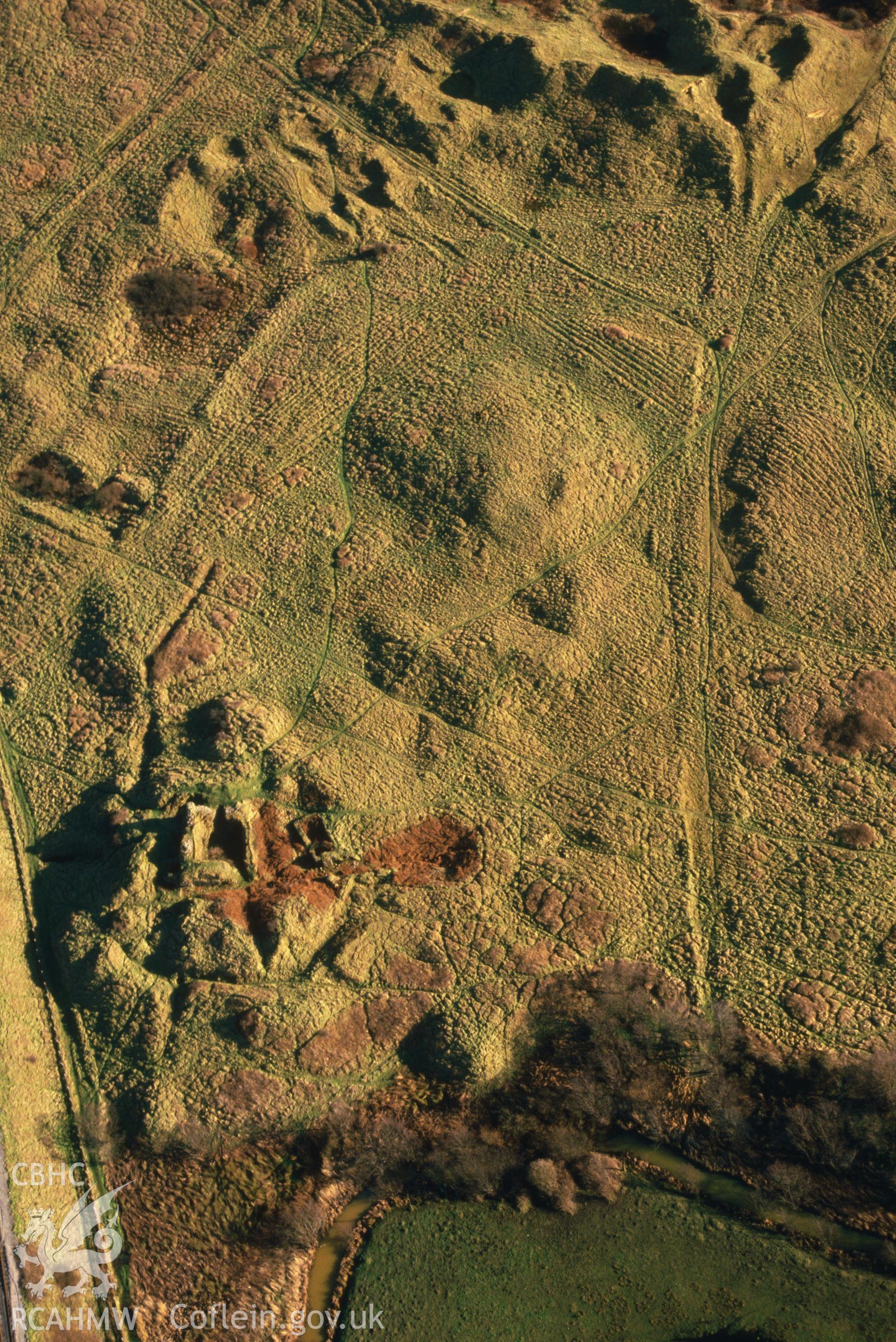 Slide of RCAHMW colour oblique aerial photograph of Kenfig Castle, taken by C.R. Musson, 6/2/1988.