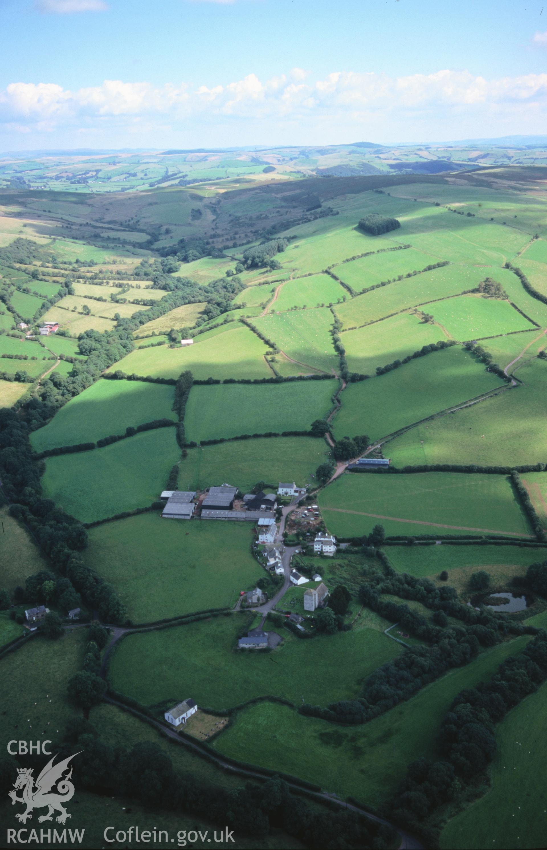 Slide of RCAHMW colour oblique aerial photograph of Llanfihangel-nant-bran, taken by T.G. Driver, 27/8/1998.