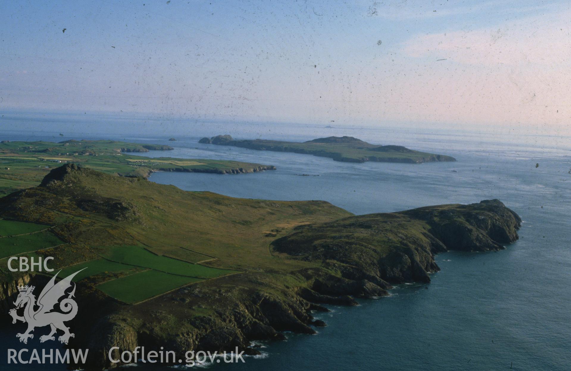 Slide of RCAHMW colour oblique aerial photograph of St David's Head And Ramsey Island, taken by C.R. Musson, 18/5/1989.