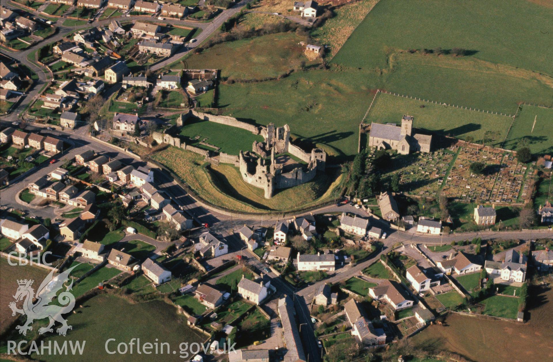 Slide of RCAHMW colour oblique aerial photograph of Coity Castle, taken by C.R. Musson, 12/2/1988.