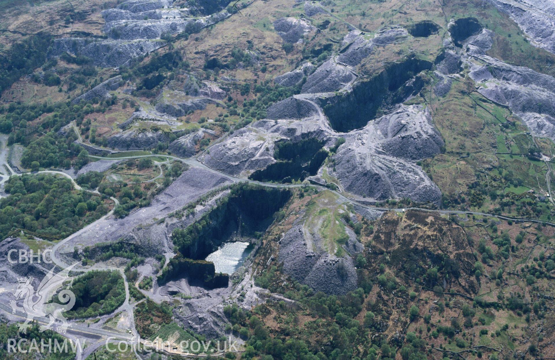 Slide of RCAHMW colour oblique aerial photograph of Glyn Rhonwy Quarry, taken by C.R. Musson, 2/5/1994.