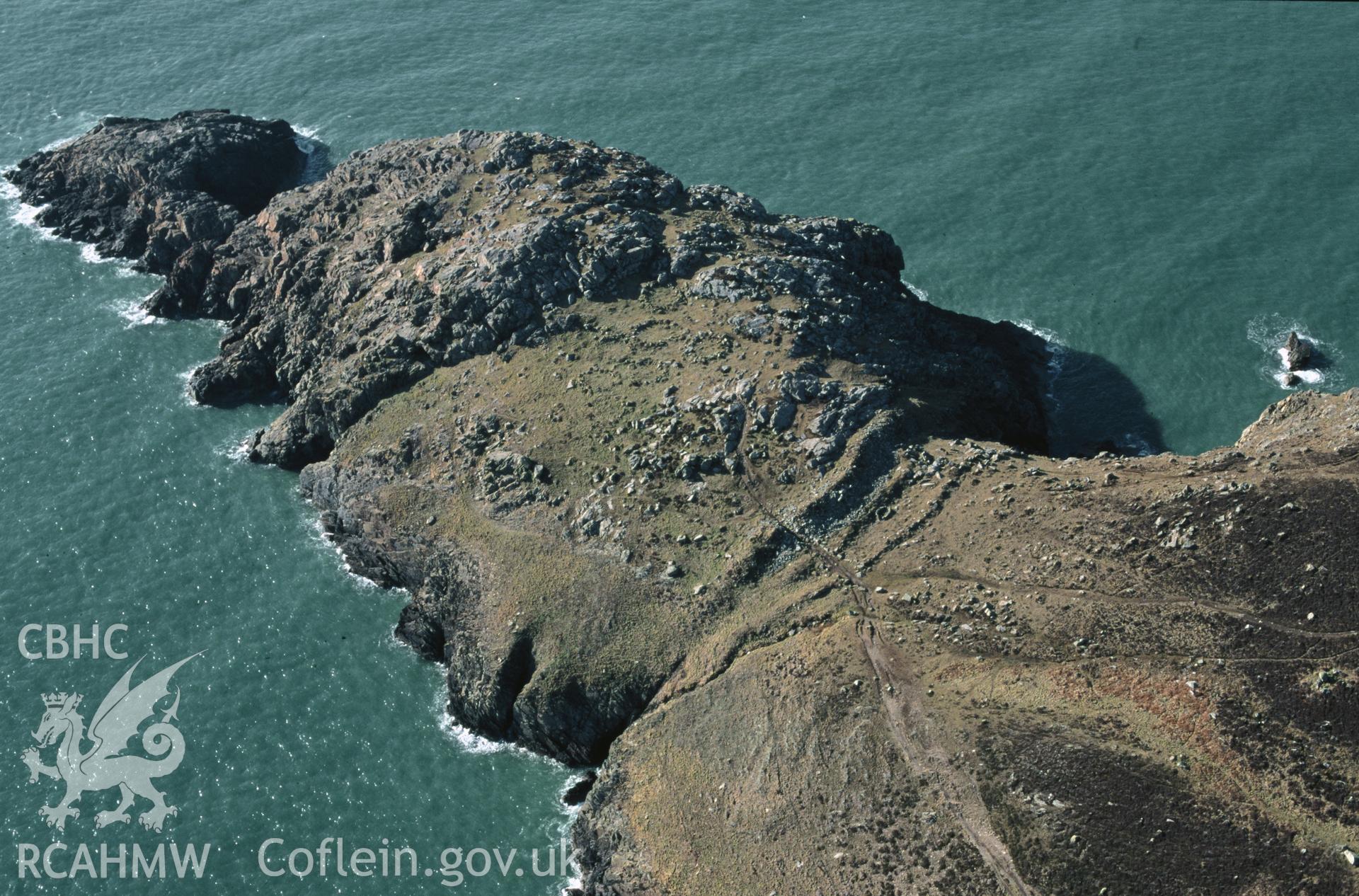 RCAHMW colour slide oblique aerial photograph of St David's Head Camp, St Davids And The Cathedral Close, taken by C.R.Musson on the 27/02/1996